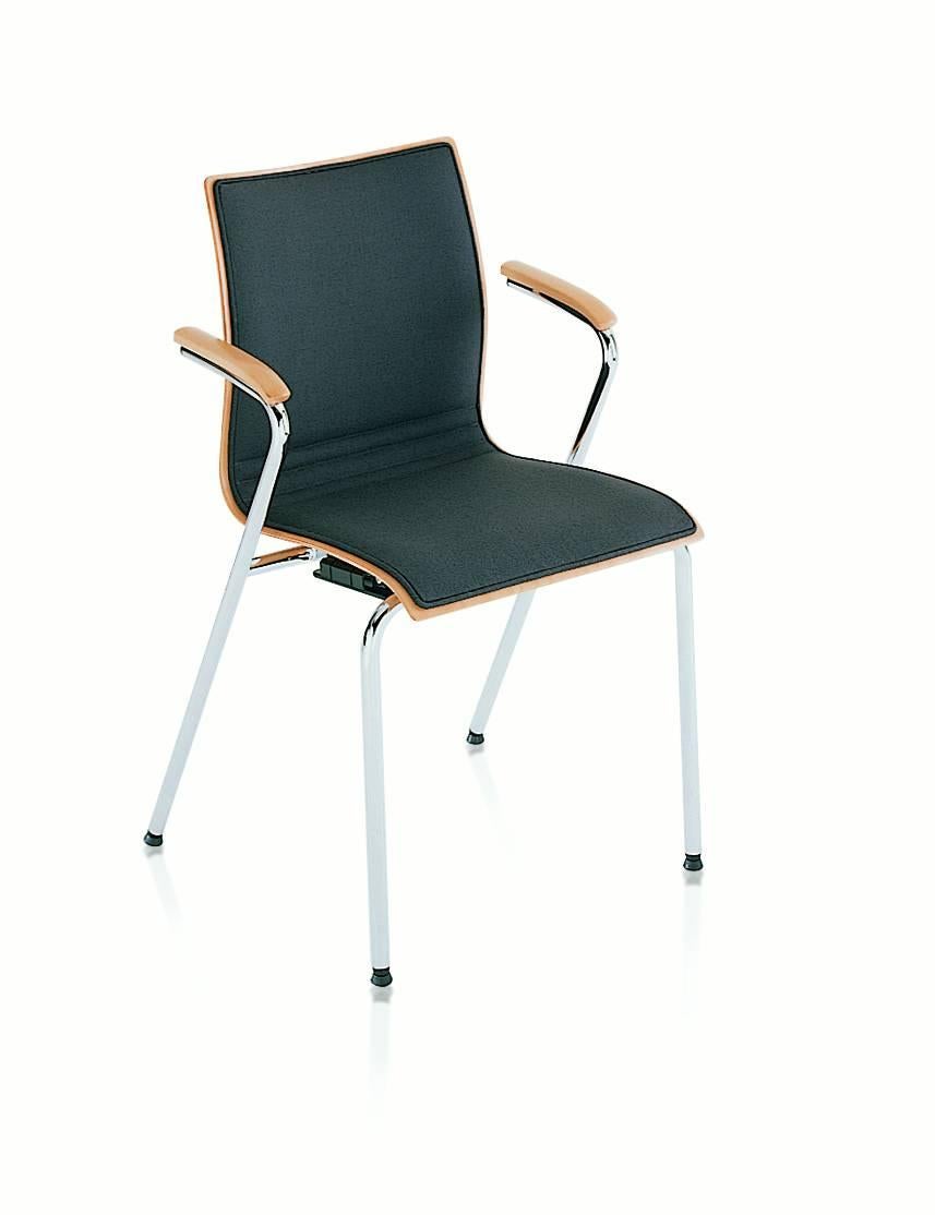 A structure in chrome-plated steel and body in beech plywood with or without arms in solid wood. All the chairs and armchairs are available in either wood or in an upholstered version. In hot the upholstery is available only in the front part of the