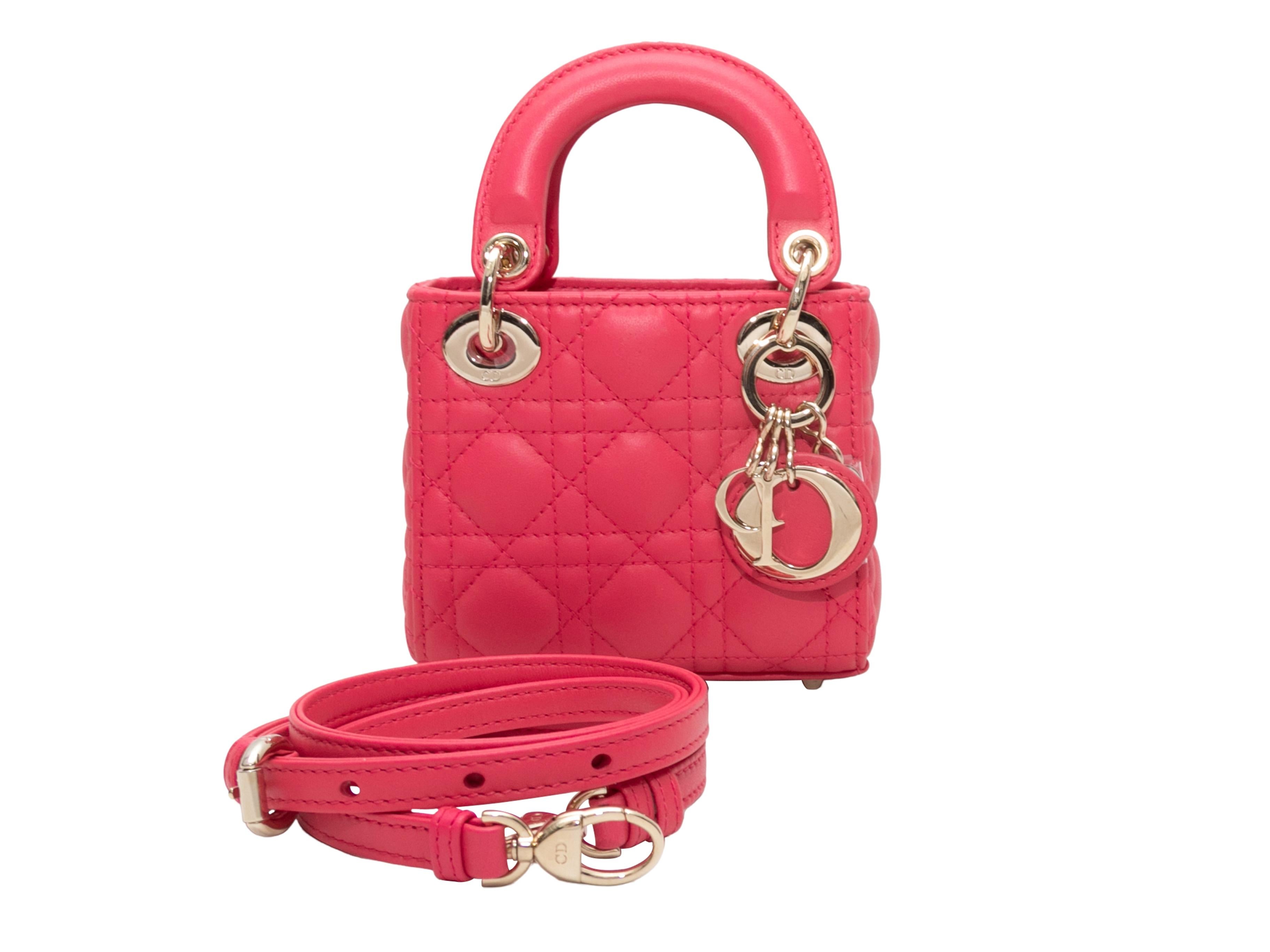 Product Details: Hot Pink Christian Dior Mini Lady Dior Bag. The Mini Lady Dior bag features a Cannage leather body, gold-tone hardware, dual top handles, and an optional crossbody strap. 5
