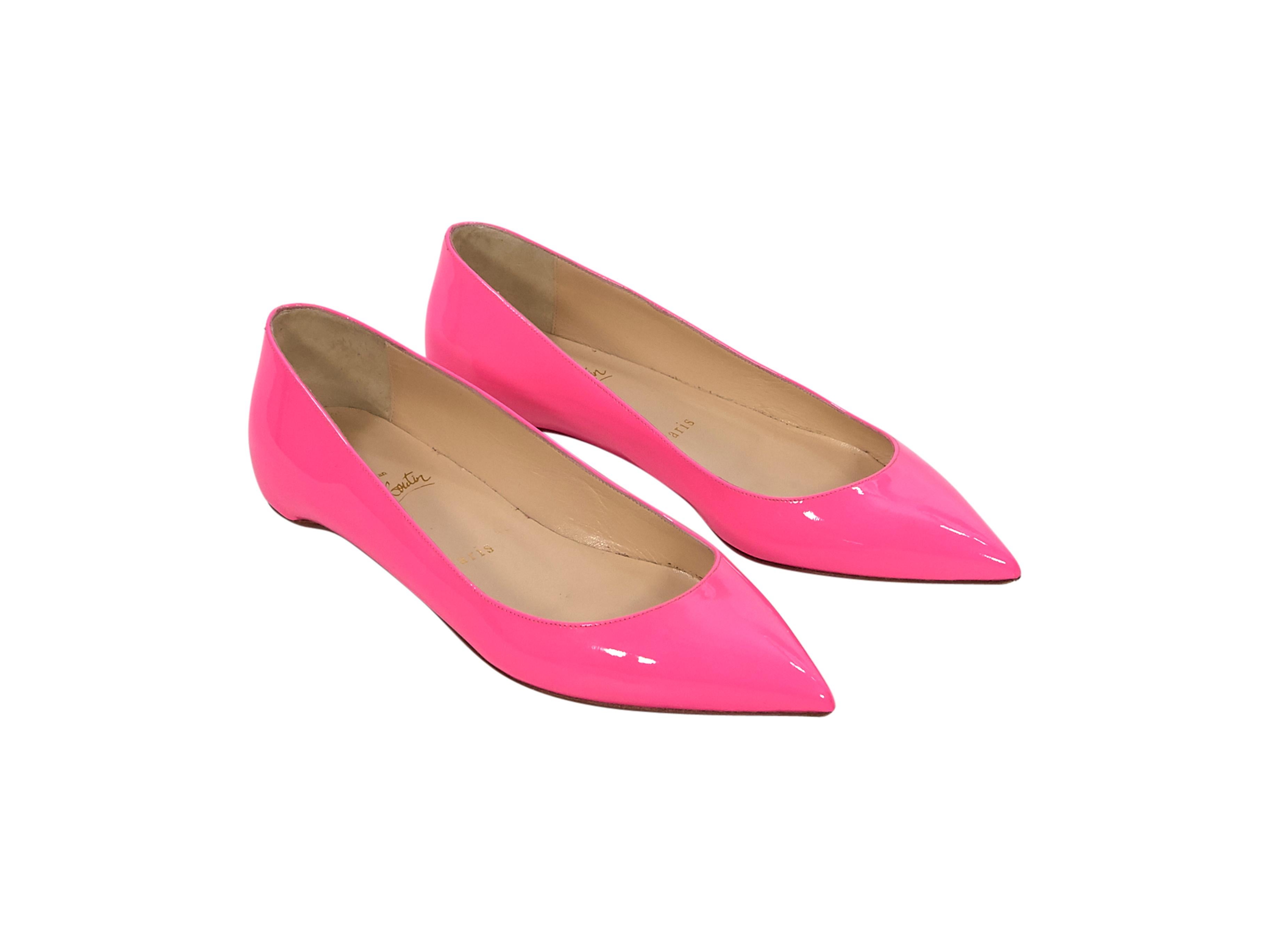Product details:  Hot pink patent leather flats by Christian Louboutin.  Point toe.  Iconic red sole.  Slip-on style. 
Condition: Pre-owned. Very good.
Est. Retail $ 595.00