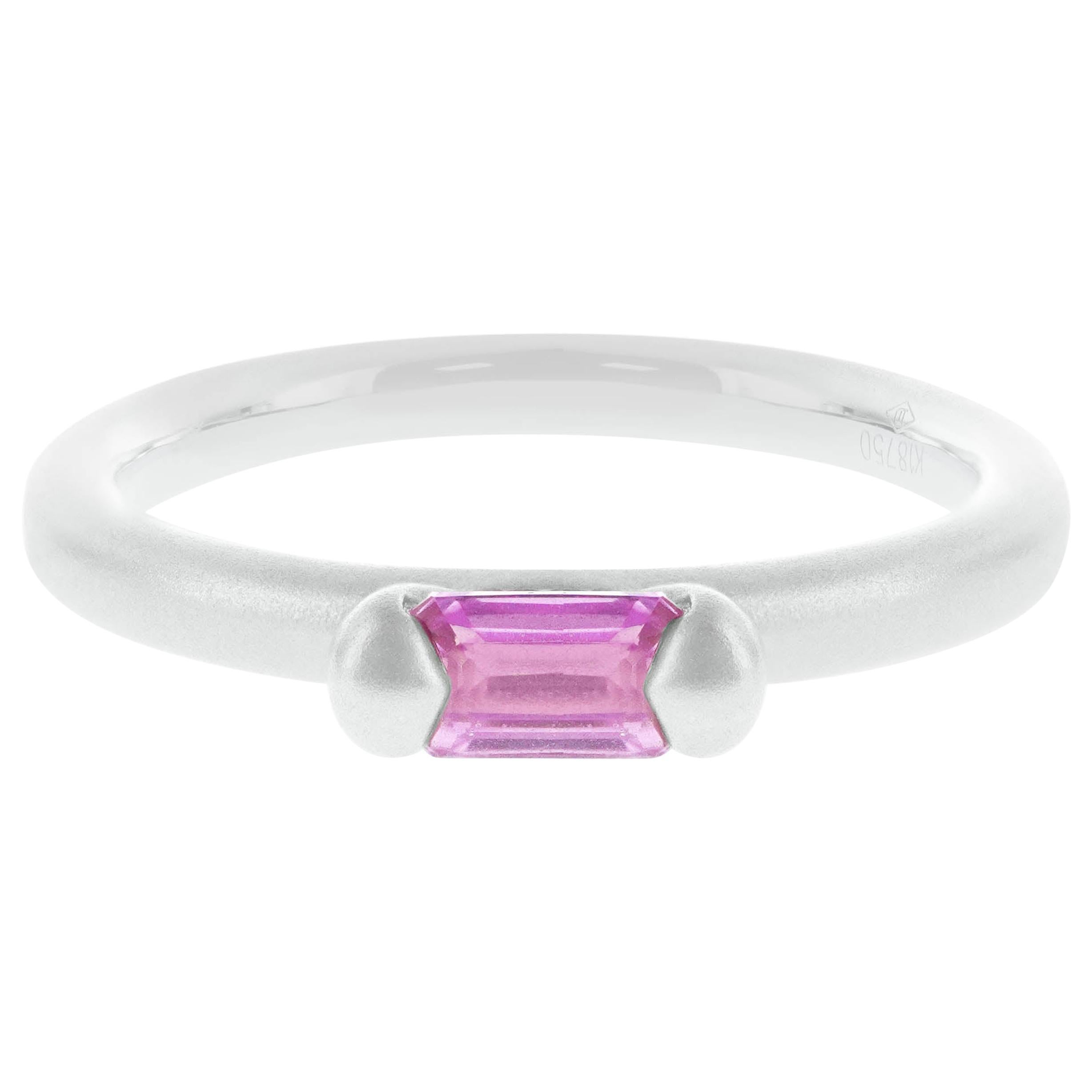 0.32 carat of super saturated hot pink sapphire is set in this 18K matt finish gold ring. The ring is hand made in Hong Kong and the gold weighs 3.31 grams. The ring can be worn as a trio ring or can be worn individually. 