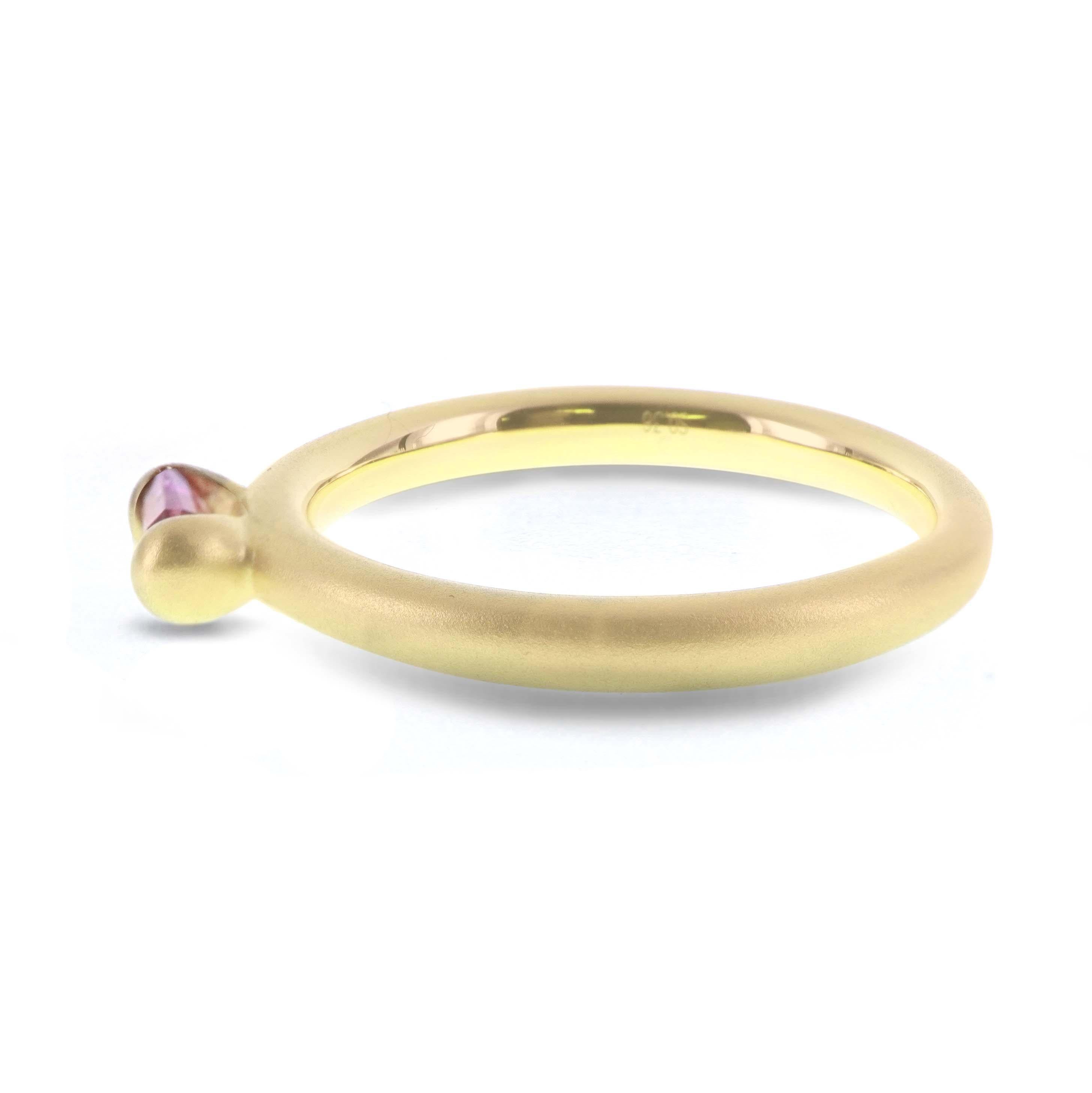 0.37 carat of super saturated hot pink sapphire is set in this 18K matt finish gold ring. The ring is hand made in Hong Kong and the gold weighs 3.31 grams. The ring can be worn as a trio ring or can be worn individually. 