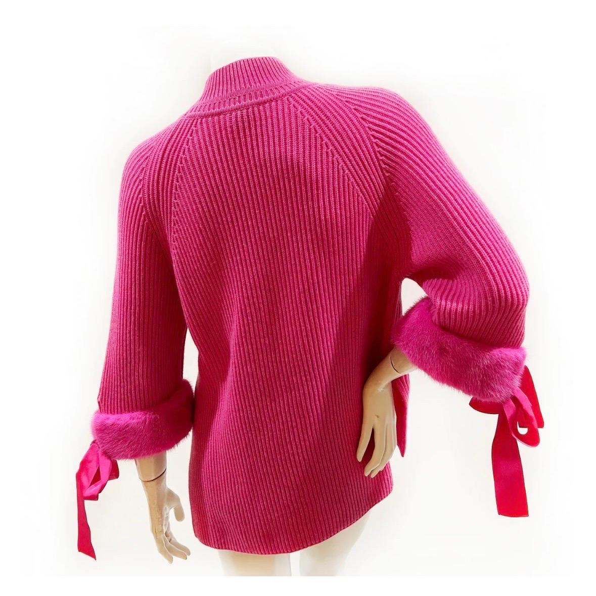 Hot Pink Cut-out Sweater by Fendi 
Spring/Summer 2018
Fendi knit sweater with neck cut-out
High Neck 
3/4 sleeves
Mink Fur cuffs with ribbon  
Pullover style
100% Cashmere
Made in Italy
Condition: Excellent, no visible signs of wear.