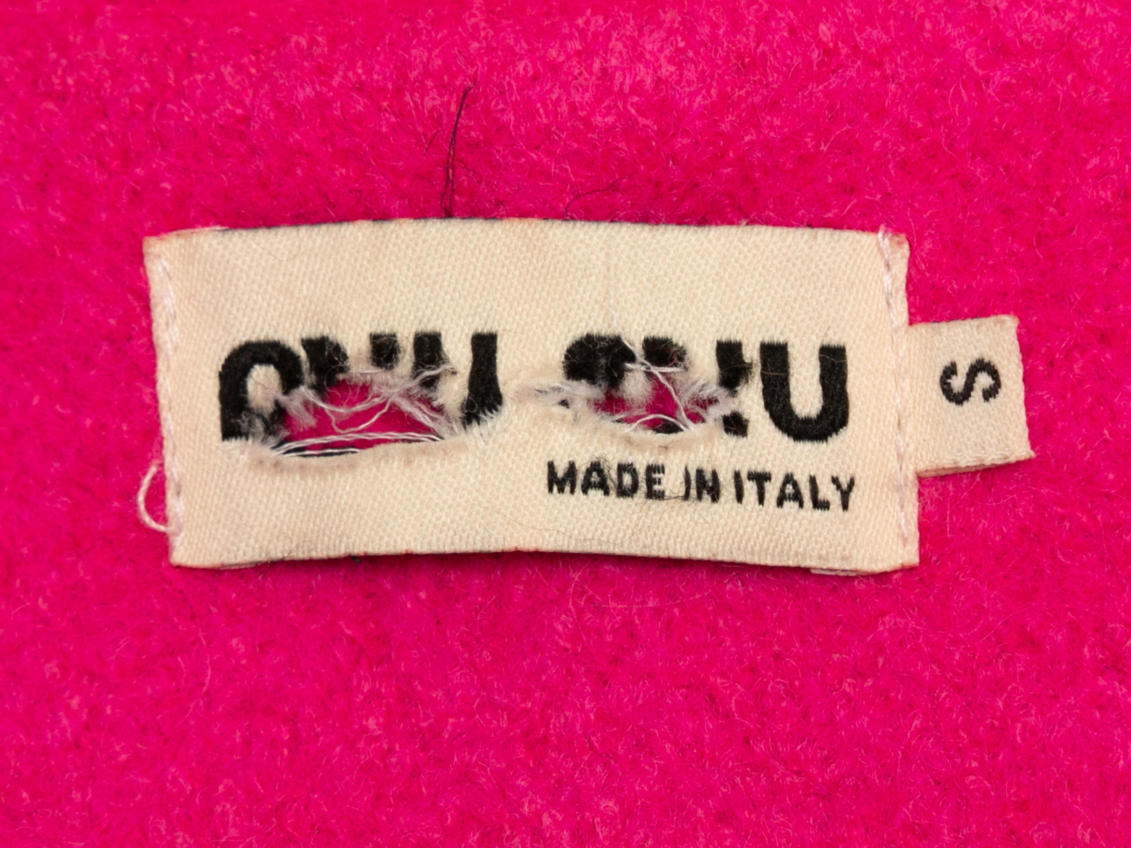 Hot pink wool double-breasted coat by Miu Miu. Notched lapel. Dual patch pockets at hips. Button closures at front. 36