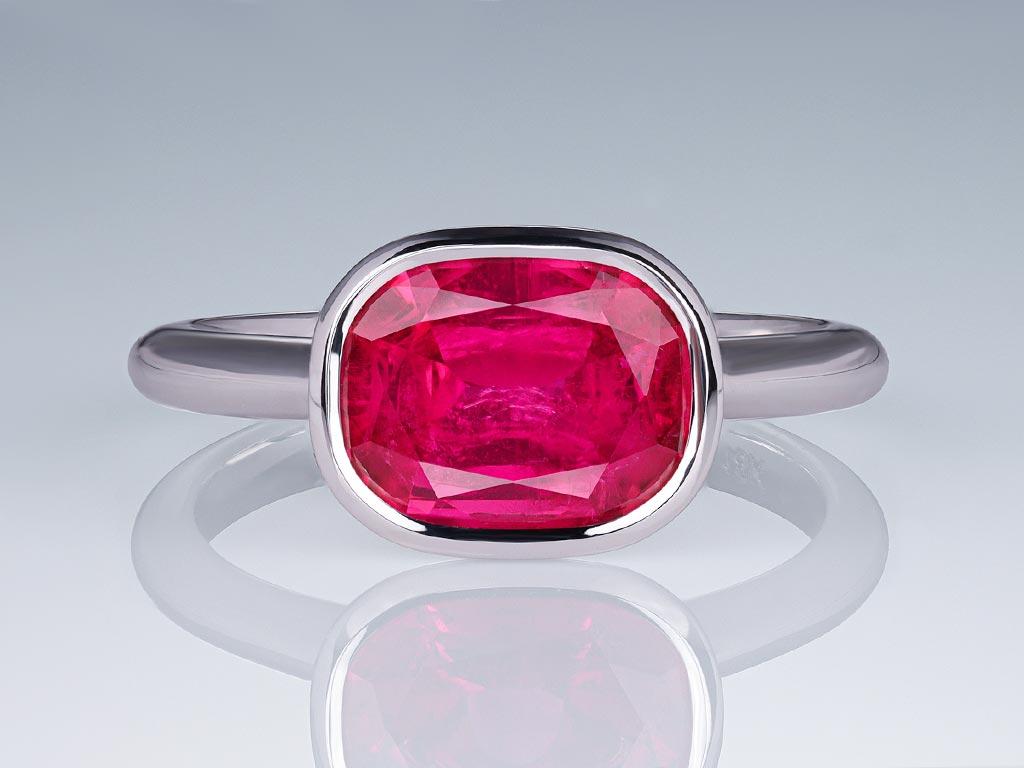 The vibrant hot pink rubellite 2.32 ct, gracefully nestled in the sophisticated white gold setting, creates a stunning visual impact, capturing attention and radiating in any light. The refined shape, expert craftsmanship, and the sparkle of the