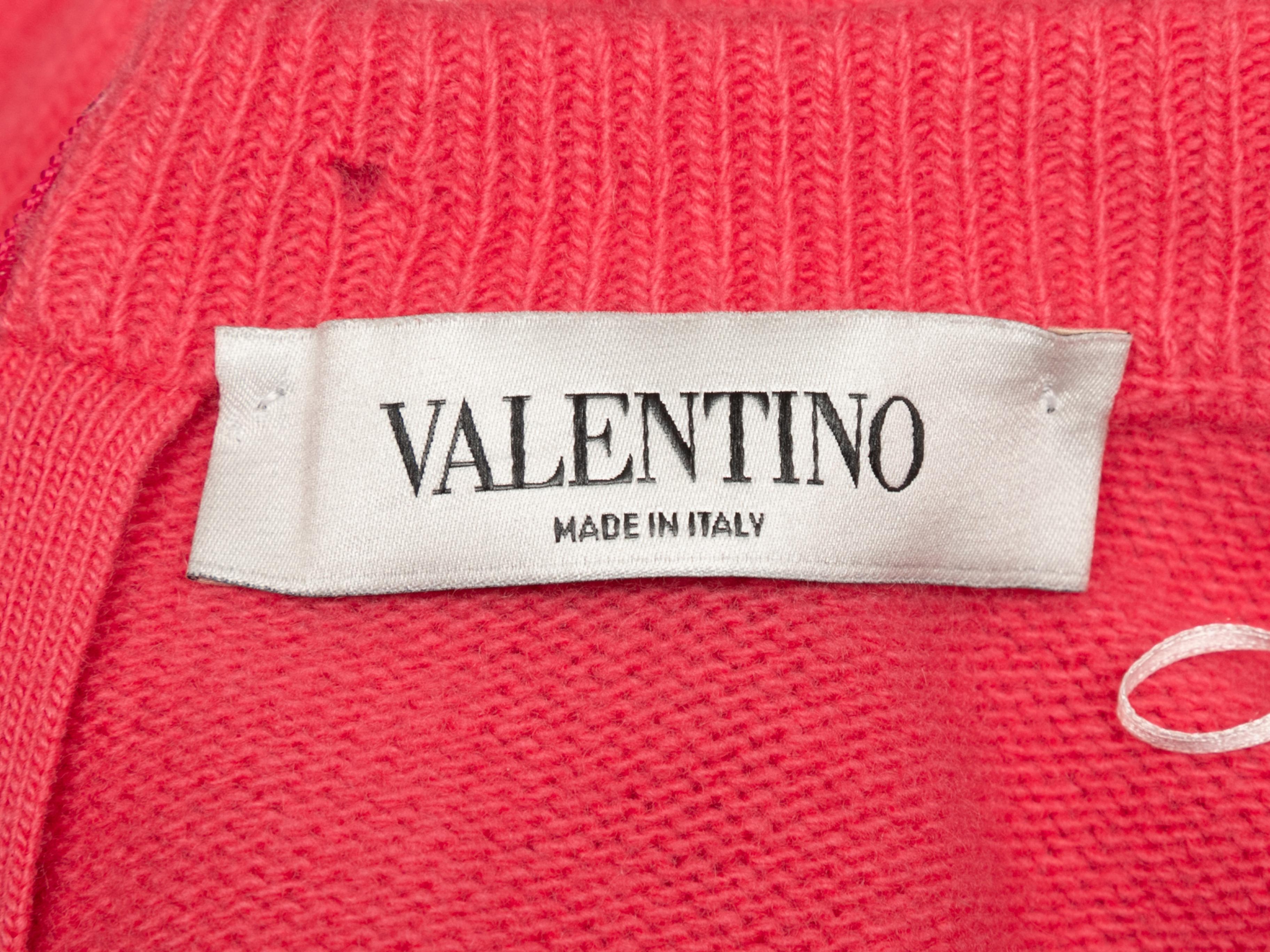 Hot pink virgin wool and cashmere sweater by Valentino. Crew neck. Zip closure at nape. 30