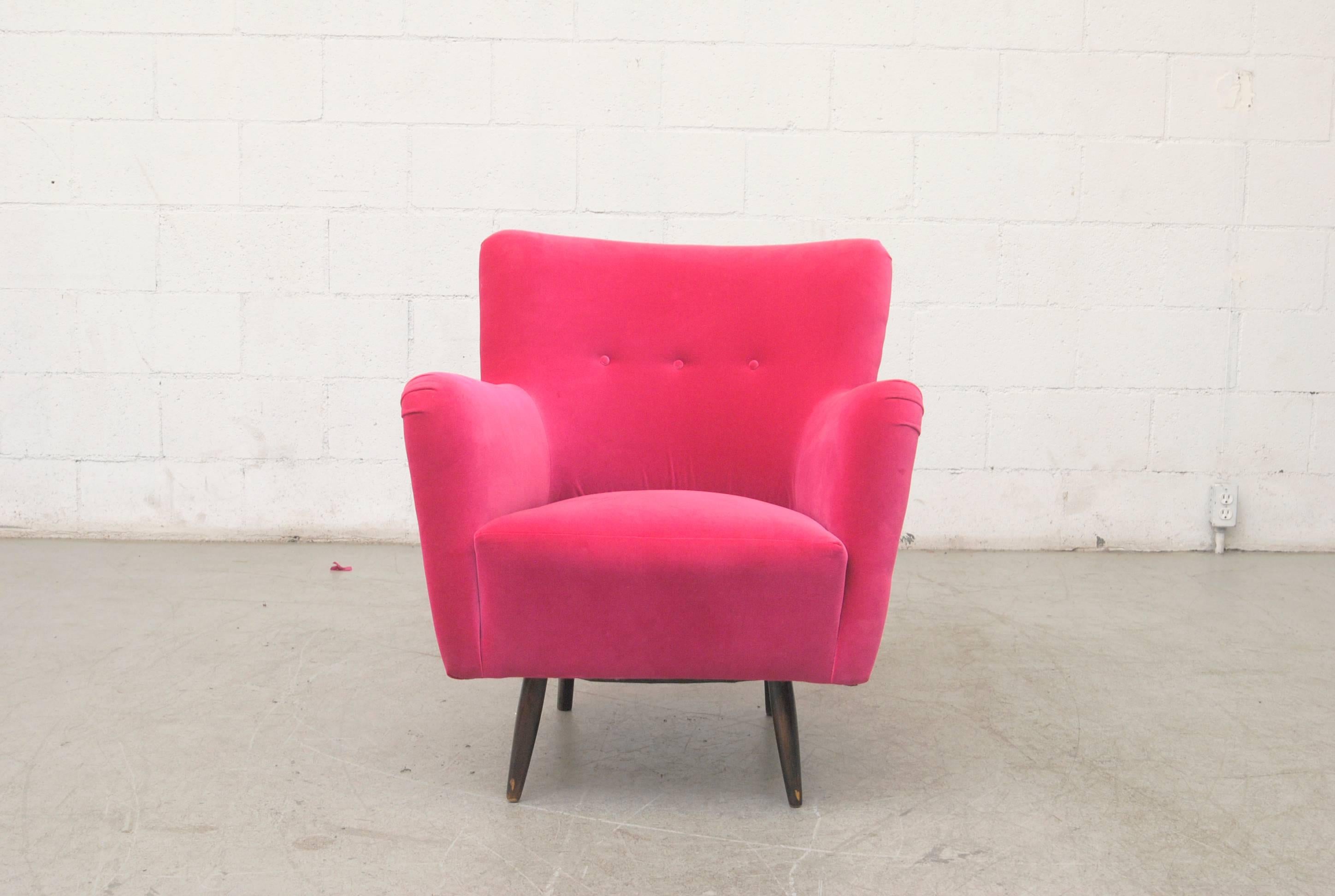 Theo Ruth lounge chair, circa 1956, newly upholstered in hot pink velvet with original dark stained legs.