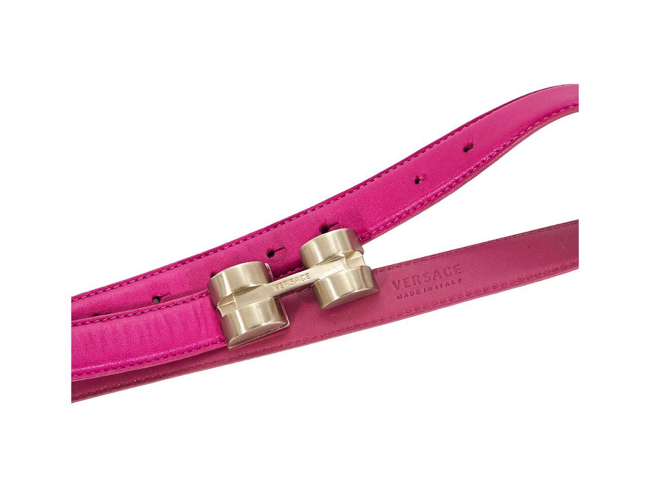 Product details:  Hot pink leather belt by Versace.  Adjustable brass buckle closure.  38.5