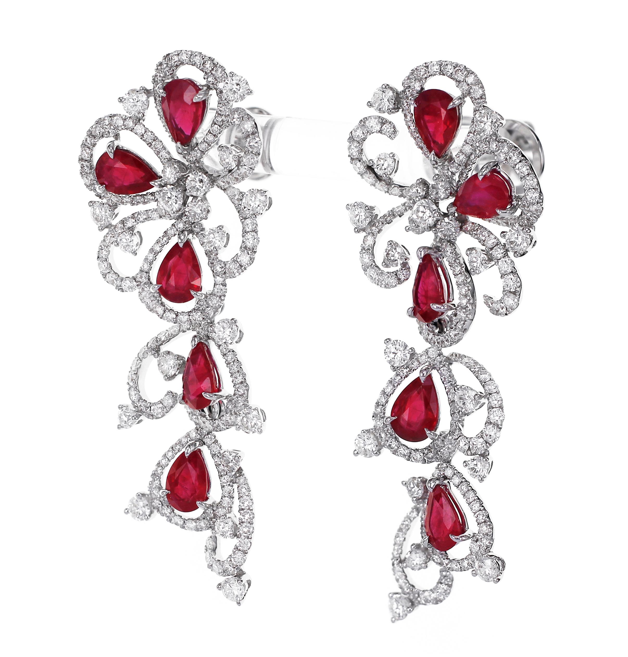 5.27 carats of vivid red ruby is set along with 3.73 carats of F color VS clarity round brilliant diamond. The earring has a graceful fall and is hand made with precision.
The details of the diamond are as follows:
Color: F
Clarity: VS

