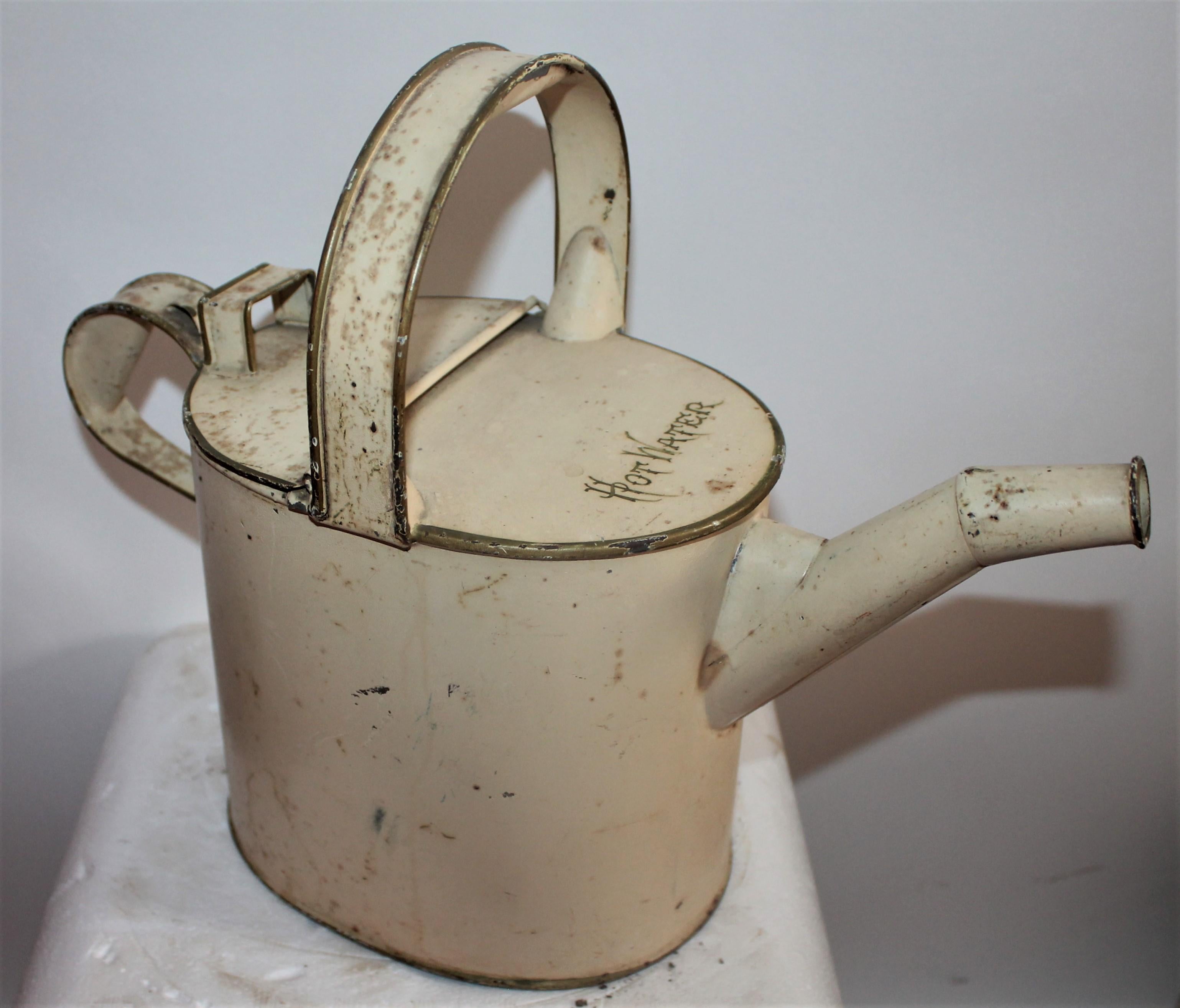 19th century hot water canister in original cream or oyster painted surface. The top of the canister it reads ”HOT WATER