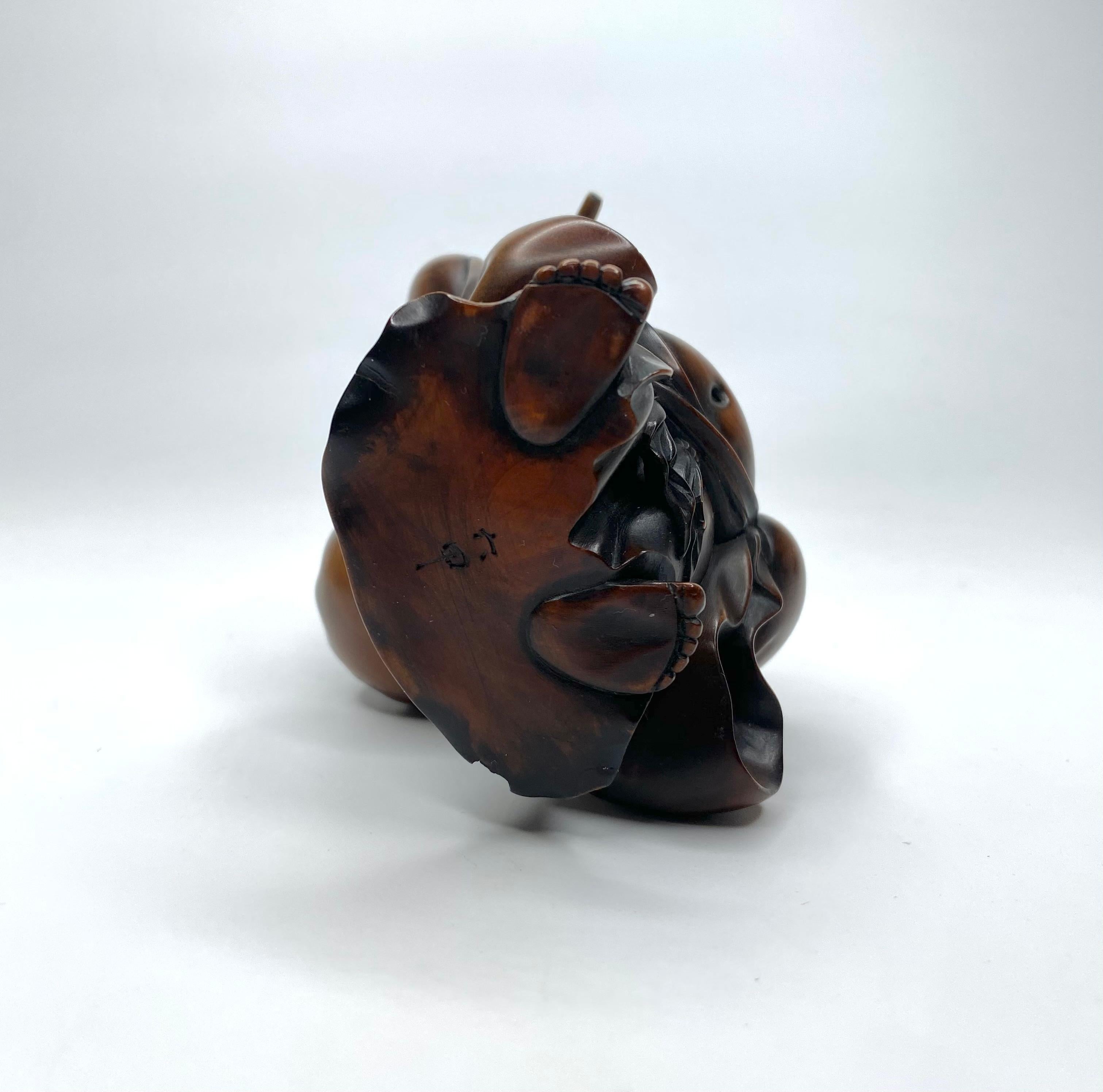 Hotei, a carved boxwood okimono, signed, Meiji Period. In Excellent Condition In Gargrave, North Yorkshire