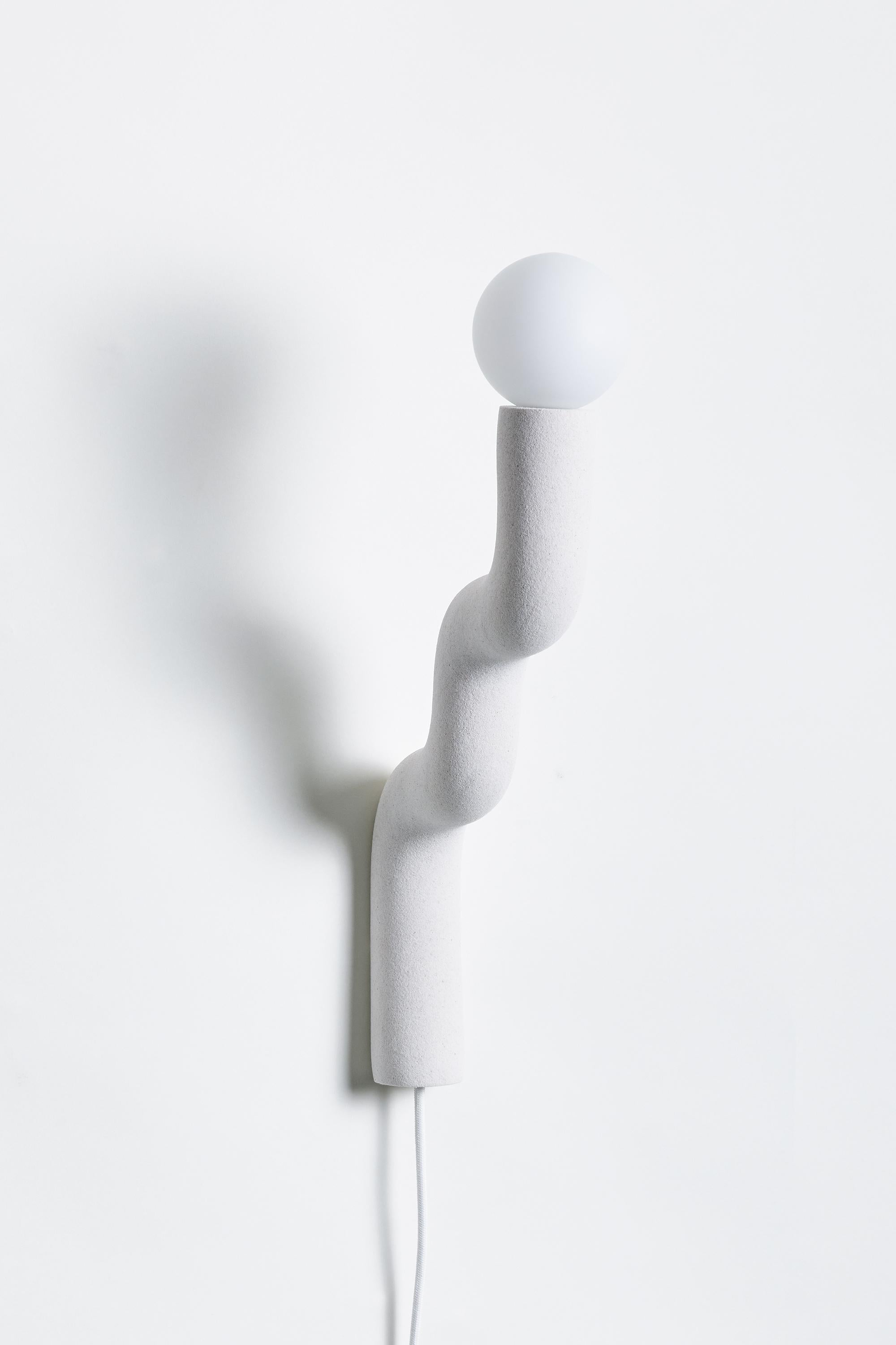 Hotel Light 07 Wall Light by Hot Wire Extensions
Dimensions: D 24.5 x W 9 x H 51.5 cm 
Materials: Waste nylon powder, natural white marble sand, copper pipe, hand-blown glass bulbs, natural cotton electrical cord.
2.5 kg

Different sands and colors