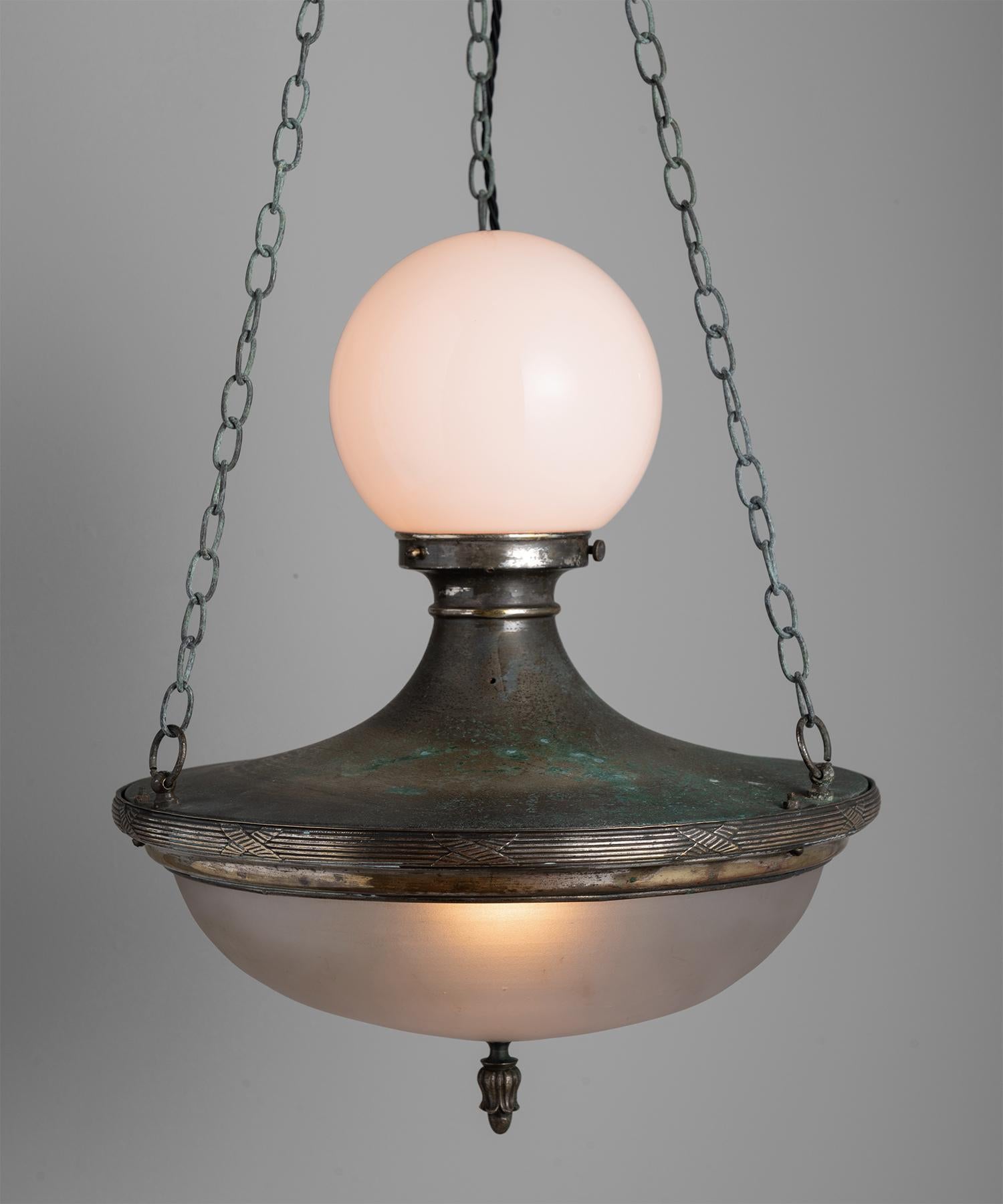 Opaline and frosted glass shades, with ornate patinated brass body.
 
  
