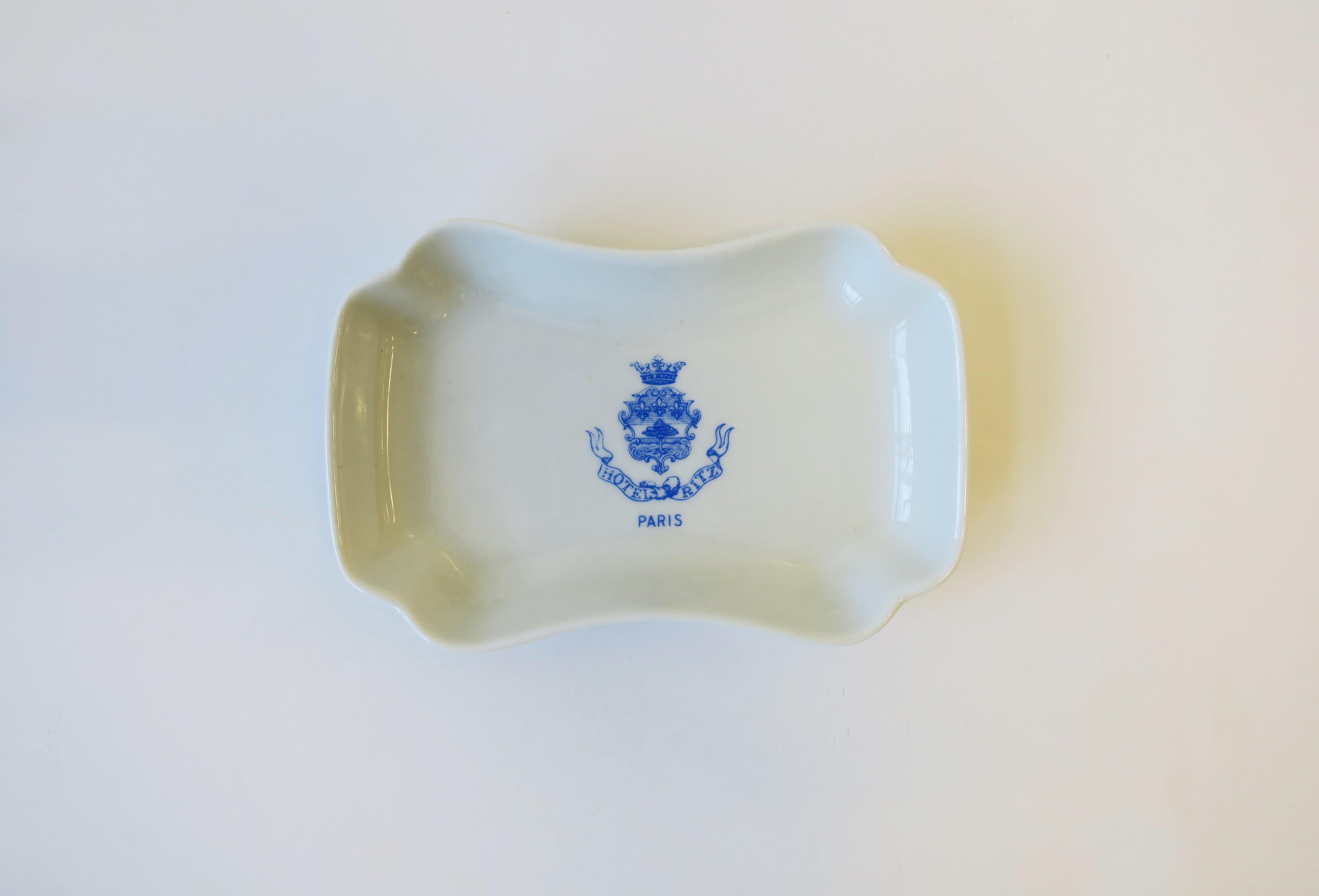 A small rectangular vintage French white and blue porcelain jewelry dish vide-poche from the Hotel Ritz, Paris. With maker's mark on bottom as shown in images #9 and 10. Made in France. A great piece for any vanity, nightstand, desk, closet area,
