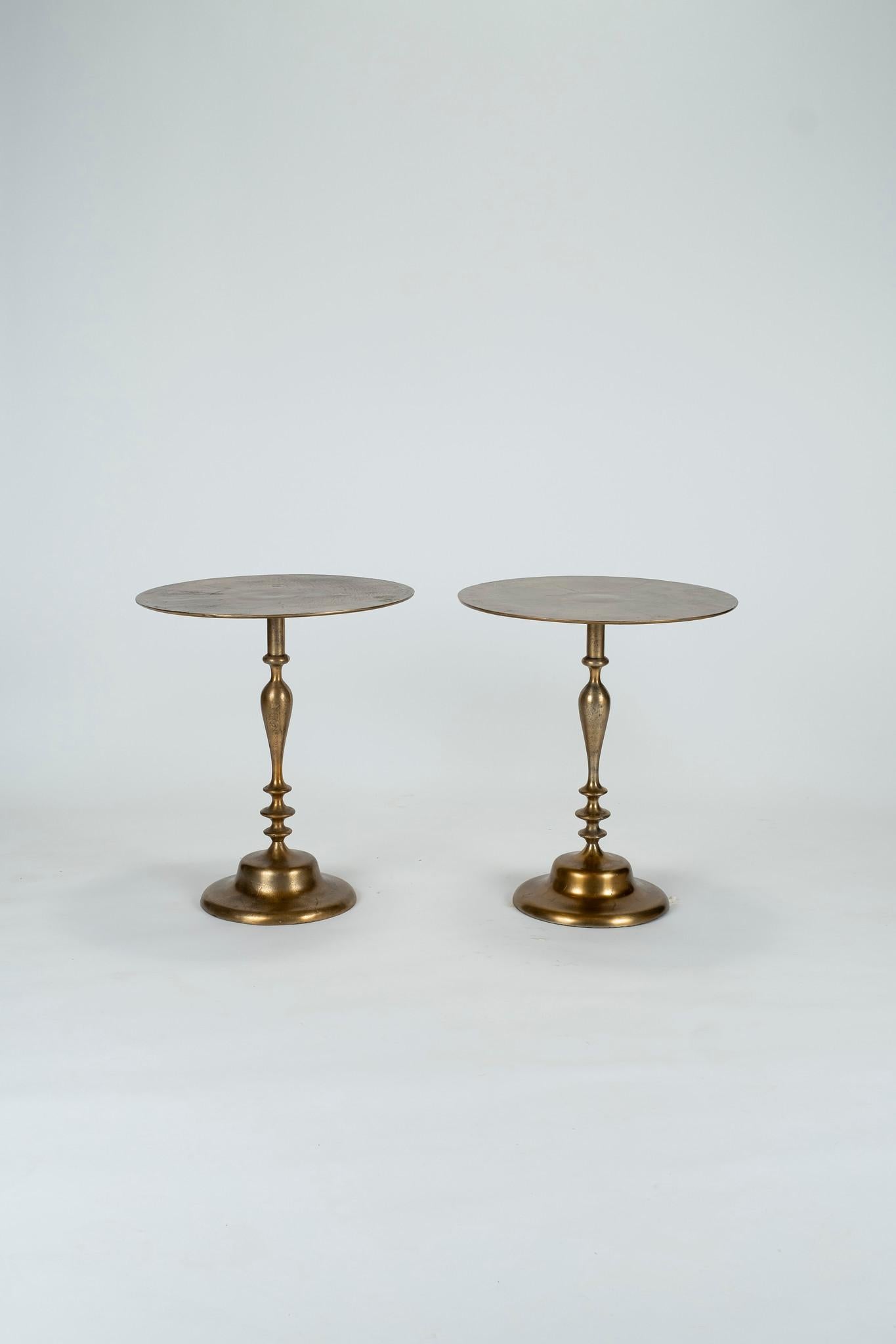 Own a little piece of history from the infamous Hotel Ritz Paris. These lovely vintage hand cast aluminum and bronze-plated tables were custom made for the hotel and have the most amazing patina.