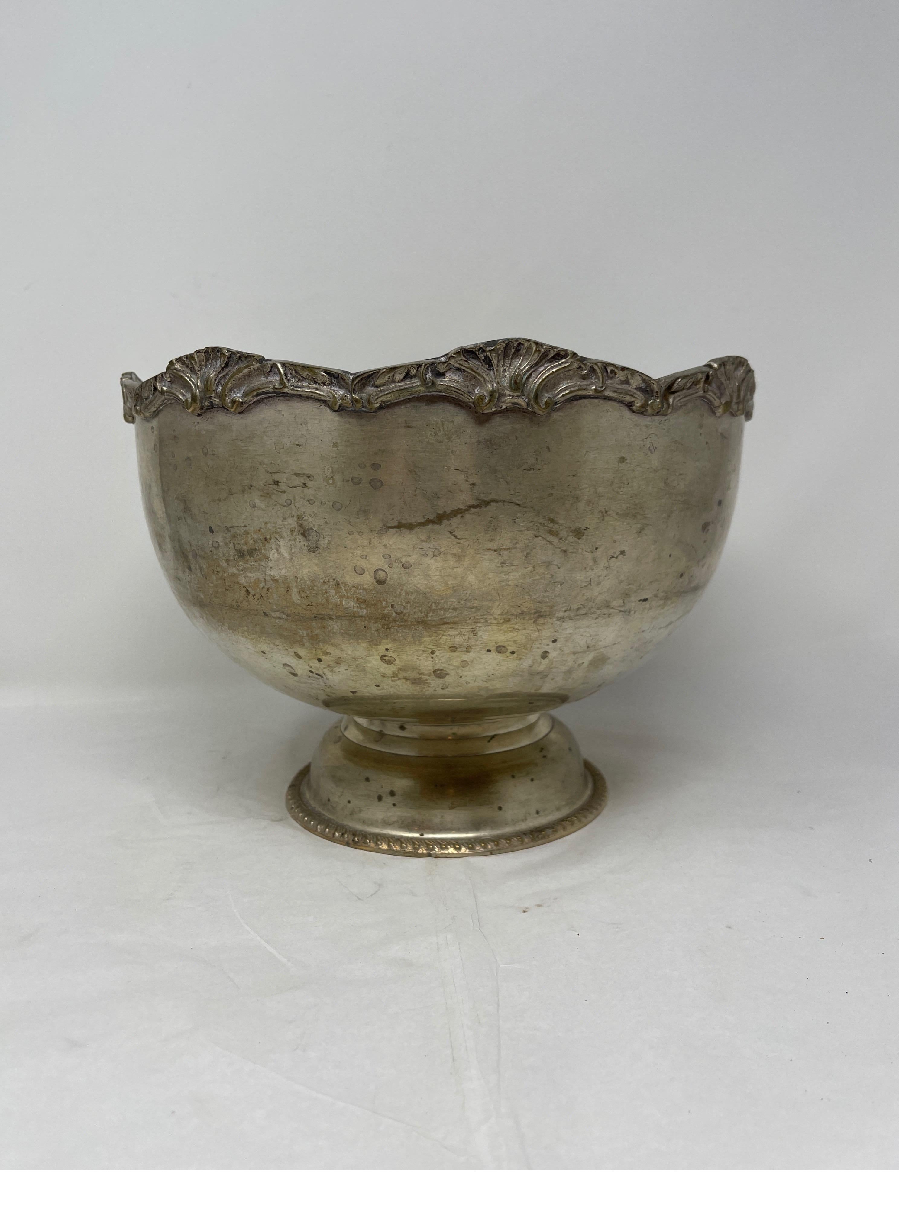 This beautifully made hotel silver champagne bowl with with etched footed bottom. This bowl has intricate scroll work around the rim. A fantastic addition to any home bar or the perfect place for your Veuve Clicquot to rest in a refreshing ice