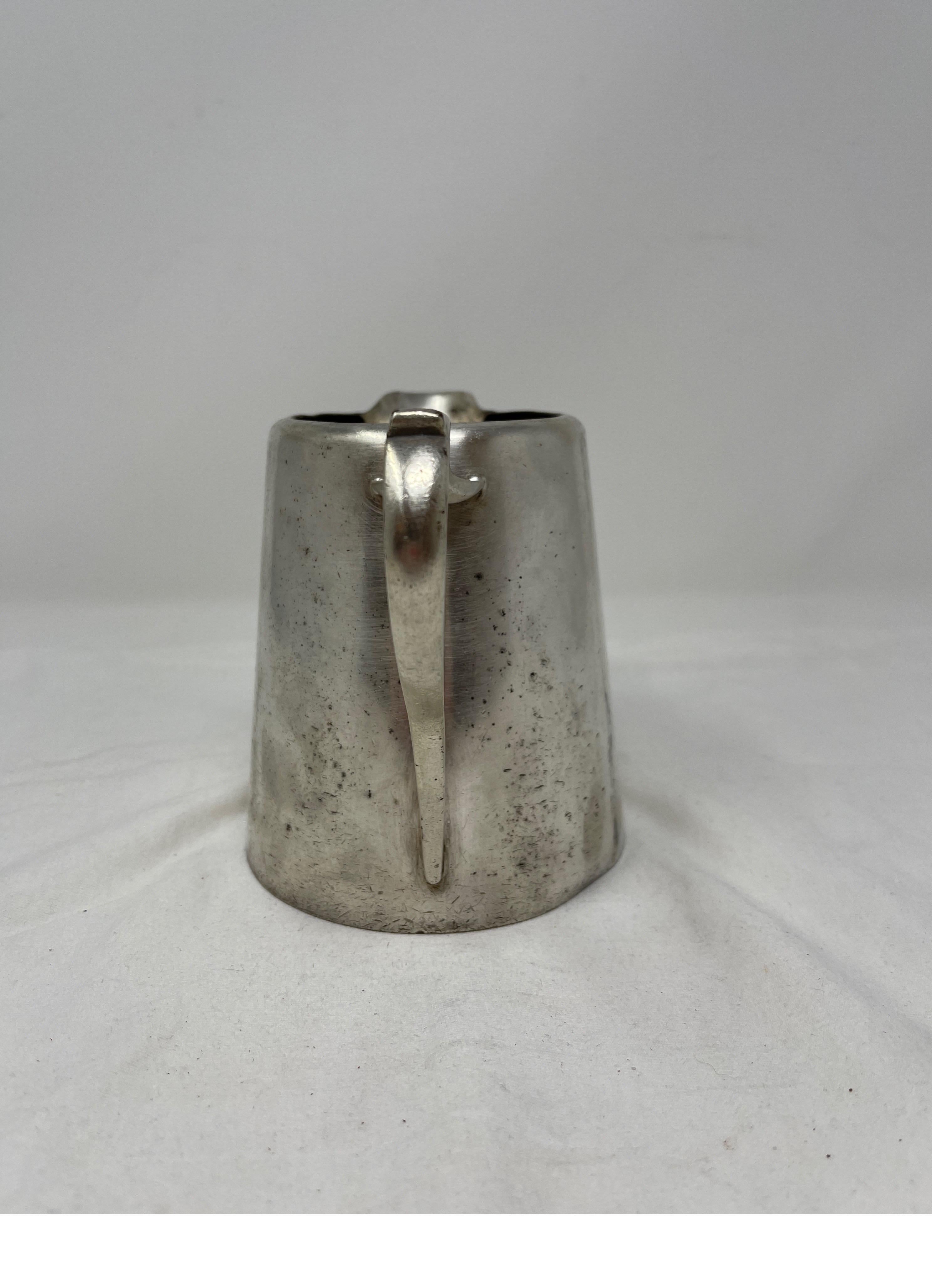 Use this 19th century hotel silver pitcher in any tea set or for fresh cut flowers. 
Measures: 5