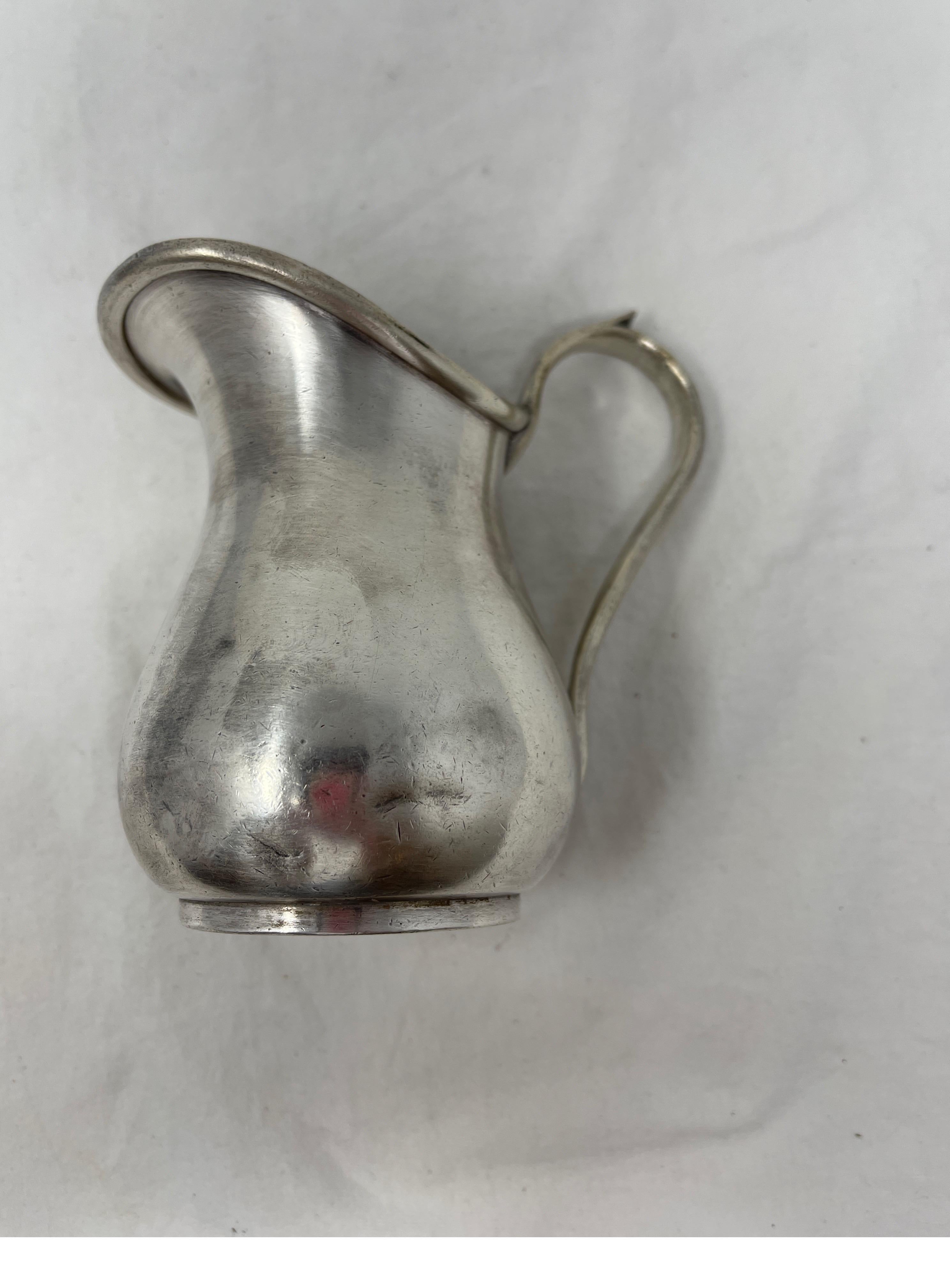 Enjoy your coffee or tea with this adorable little 19th century Hotel Silver creamer. Elevate your morning routine or use this pitcher to old pens, pencils or a fresh cut flower.

Measures: 3