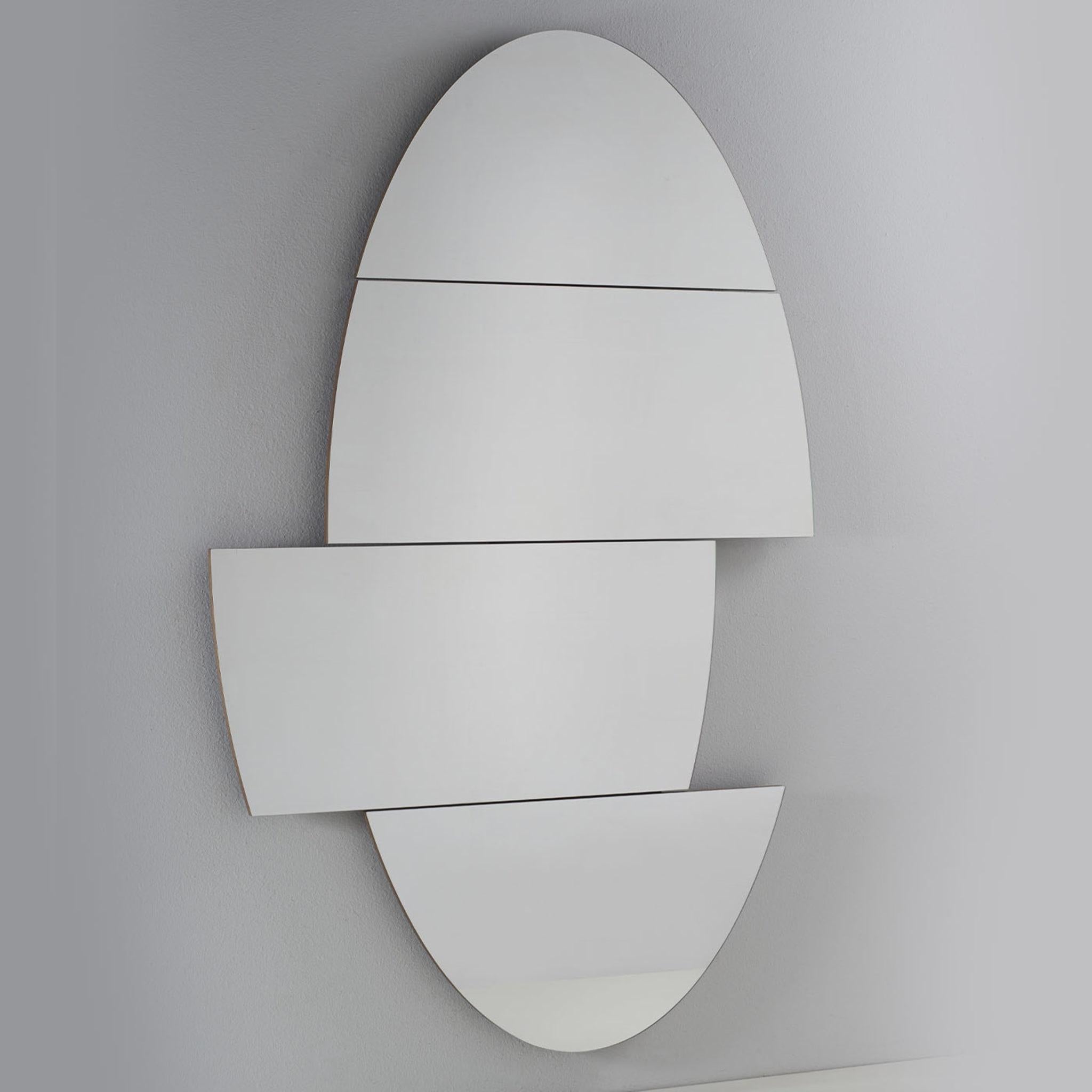 Playfully inspired by and named After the iconic illusionist, this oval mirror combines art and functionality within its transformist design. Four mirrored glass elements compose its structure, their movable quality allowing to achieve always new,