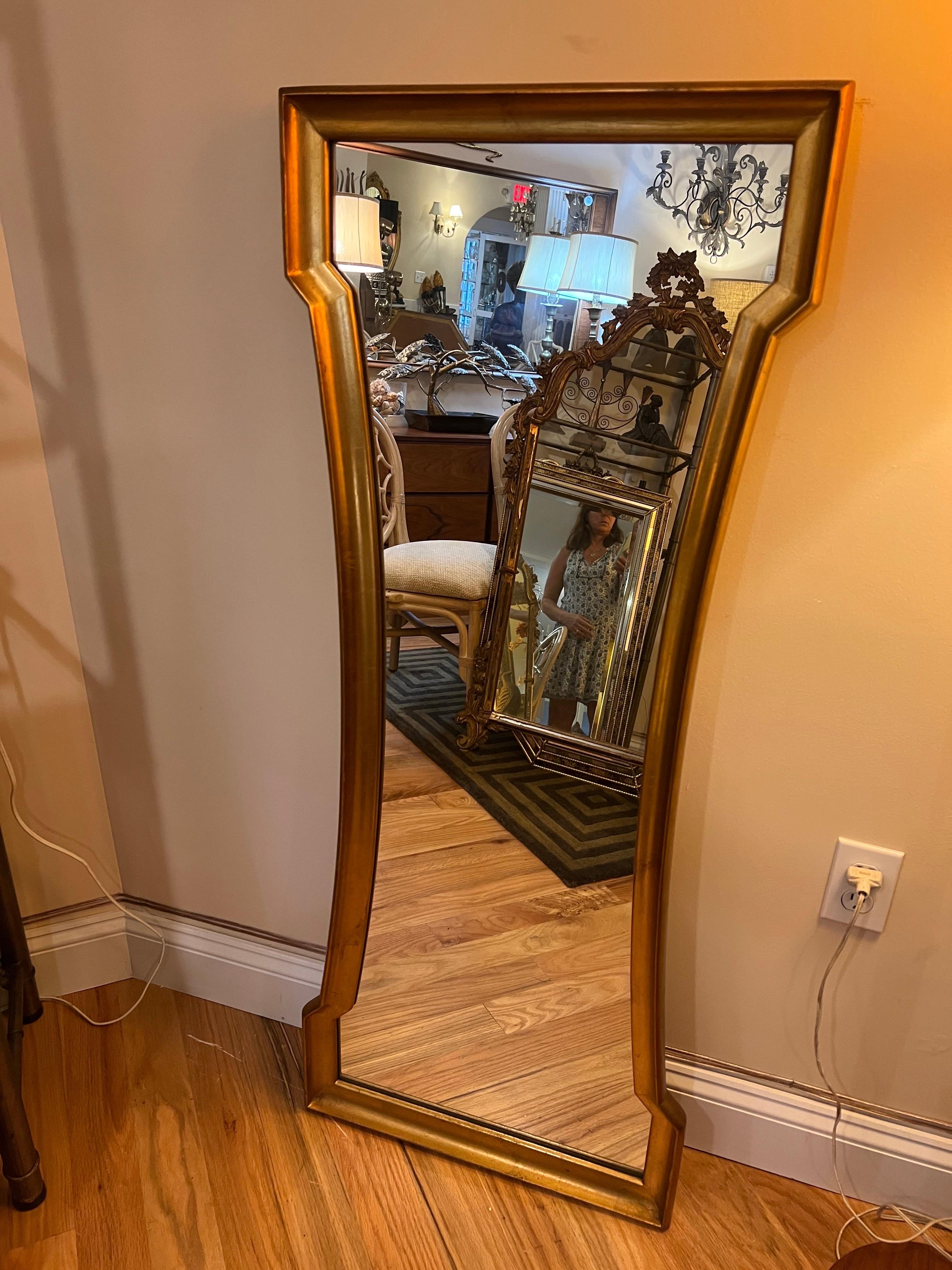 Hourglass gold leaf mirror by Weiman. Unique shape to bring pizzazz to any room. Hang either way. Use above a vanity or in a hallway. Or best as a vanity mirror above a sink with some busy wallpaper. At the mirrors most narrowest part in the center