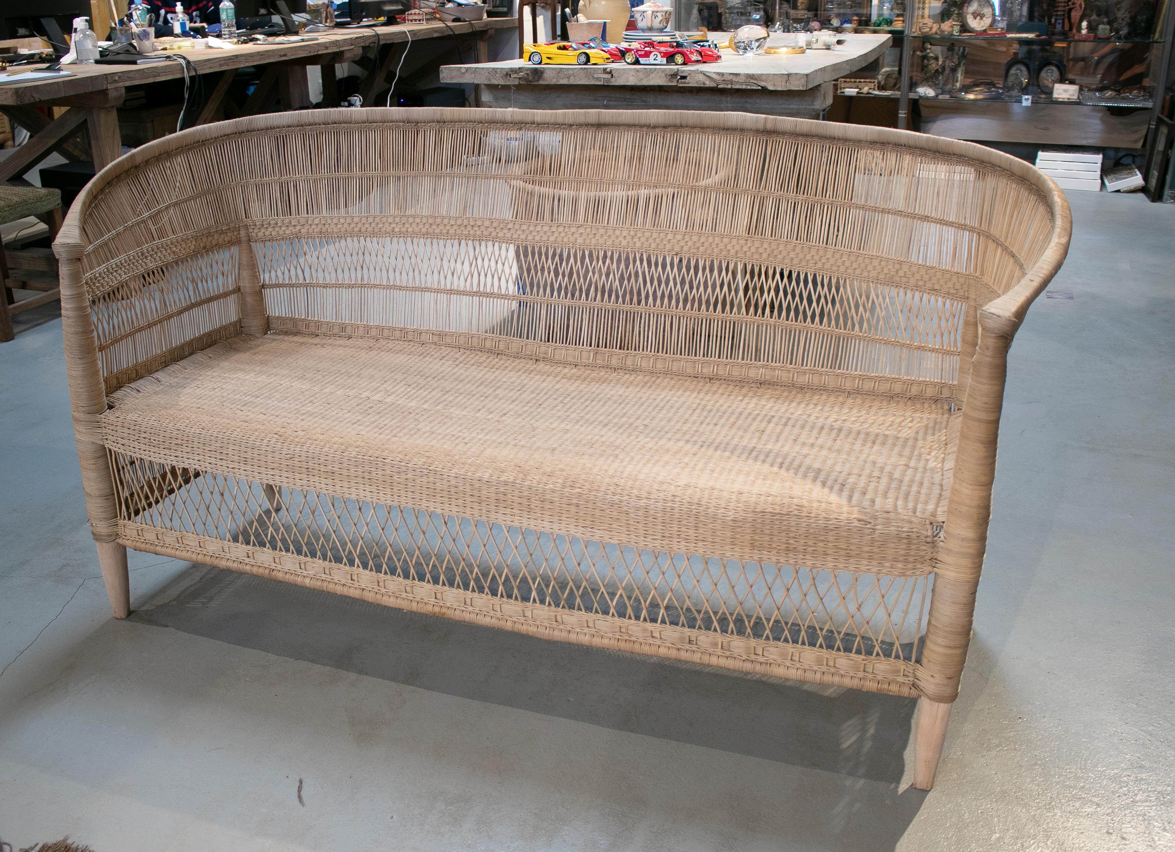 House and garden hand woven rattan sofa with wooden structure.