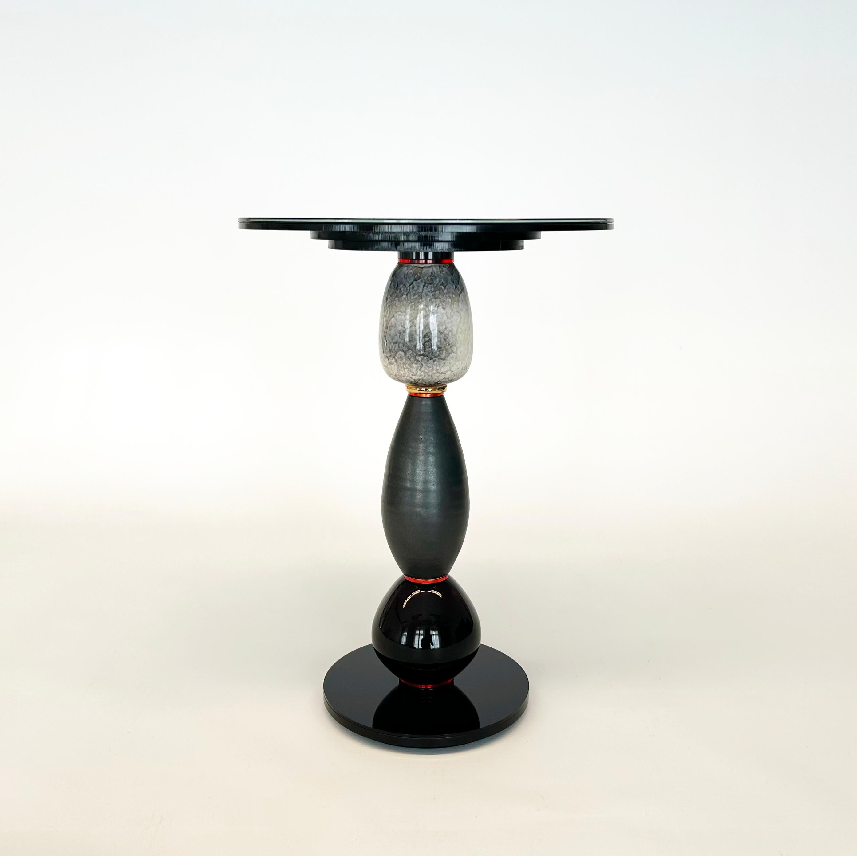 Designer and Artis Andreas Berlin created a collection of extraordinary side tables. This tables are sculptures and high end useful upcycling tables. The vases found in antiquarian stores become a new life as a segment of a sculpture. A clever