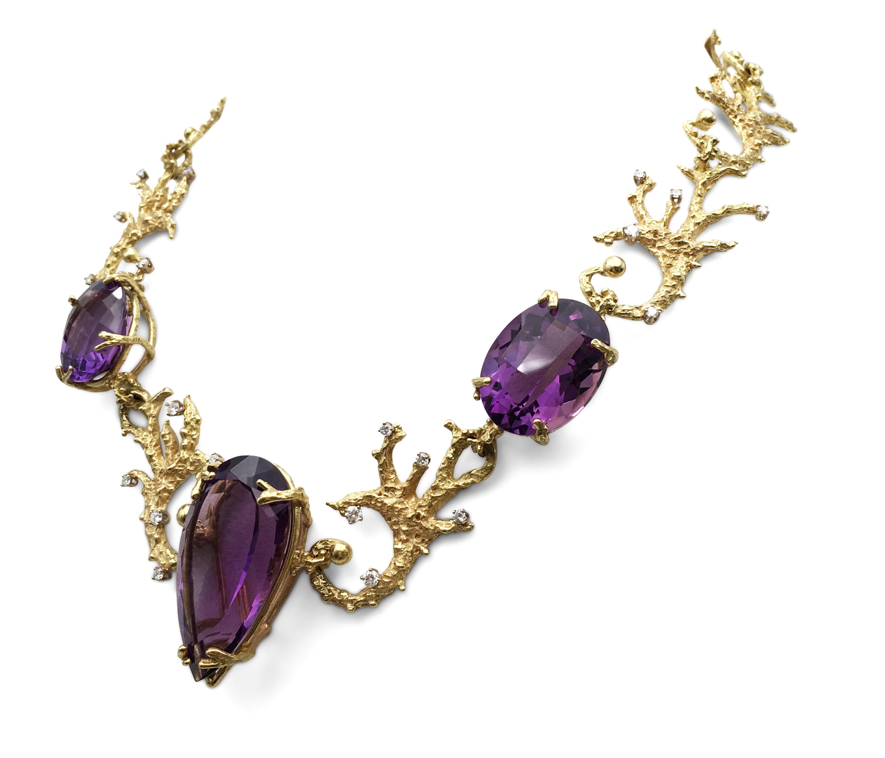 A one of a kind necklace created by the House of Murat is crafted in textured 18 karat yellow gold and features lively three amethyst stones weighing an estimated 39.75 carats in total. The necklace is accented with high-quality round brilliant cut