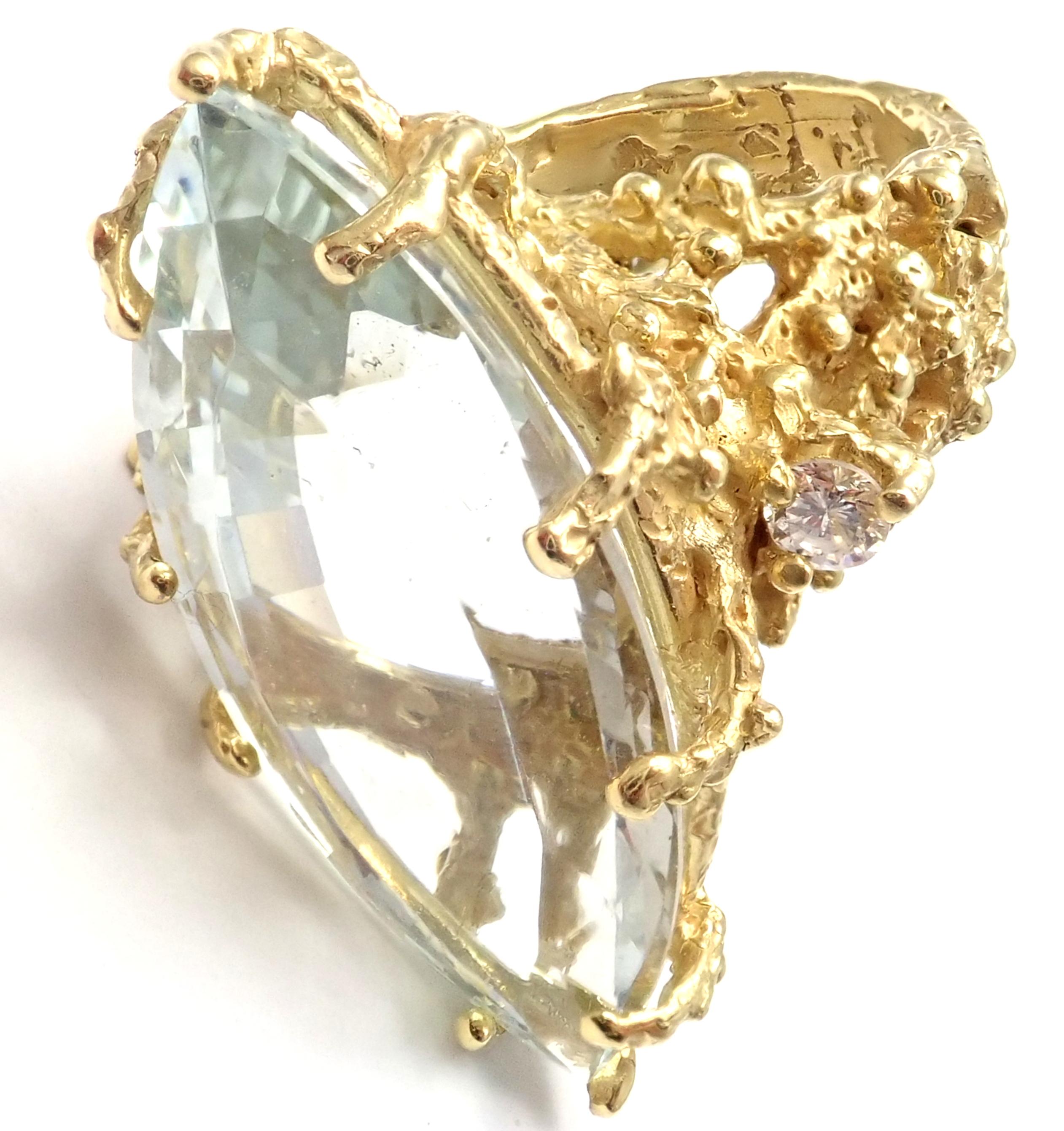 Anillo de oro amarillo de 18 quilates con diamantes y aguamarina de 25 quilates, de House of Murat.
Con 2 diamantes talla brillante redondos claridad VS1, color G peso total 0,40ct
1 aguamarina grande peso total aproximado 25ct
Detalles:
Tamaño: