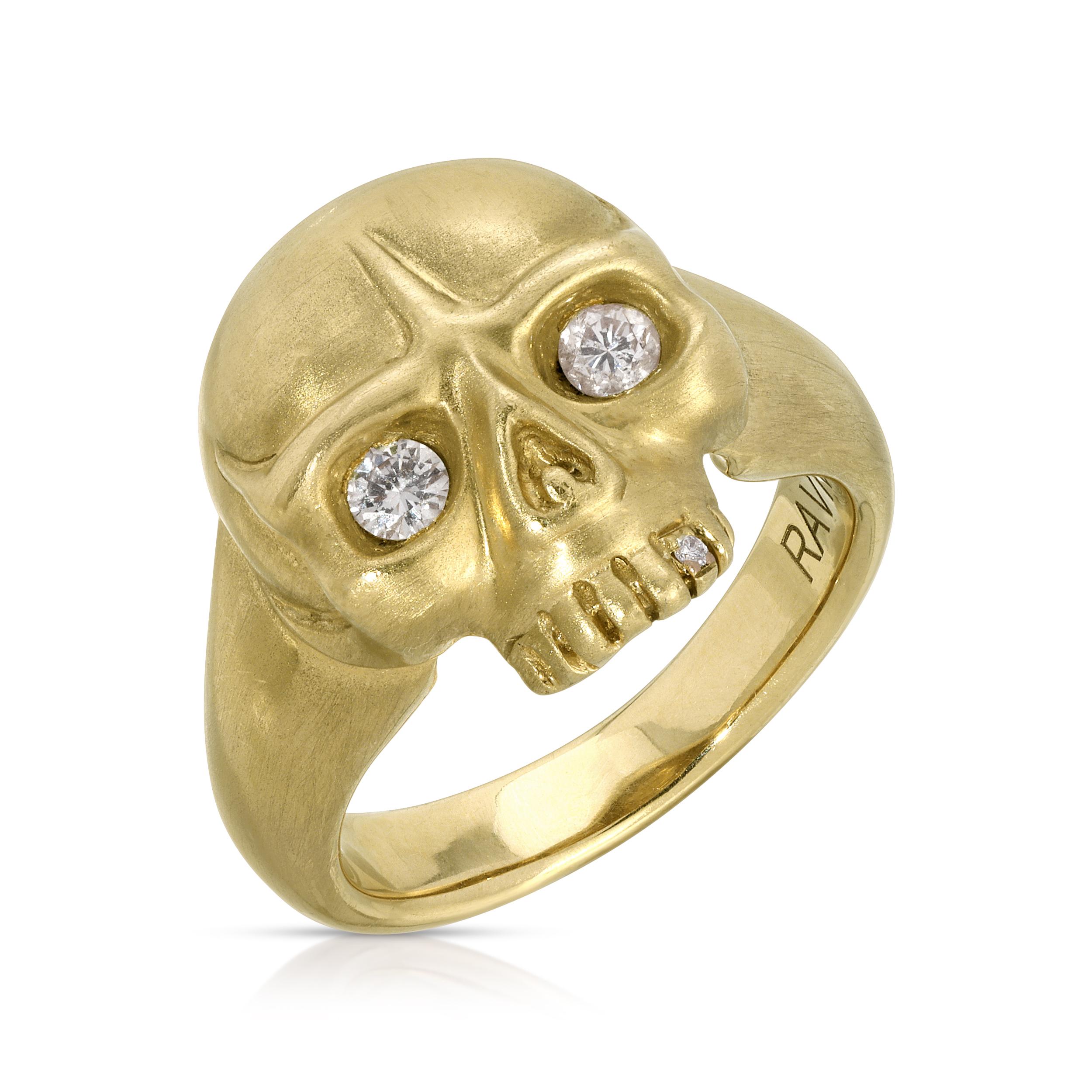 14k yellow gold, hand carved, skull ring, with diamond eyes.

The House of RAVN hand carved petite jawless skull ring. 14k yellow gold, weighing 10 grams. Featuring diamond eyes, baguette diamond accent tooth and a hidden diamond inside the band.