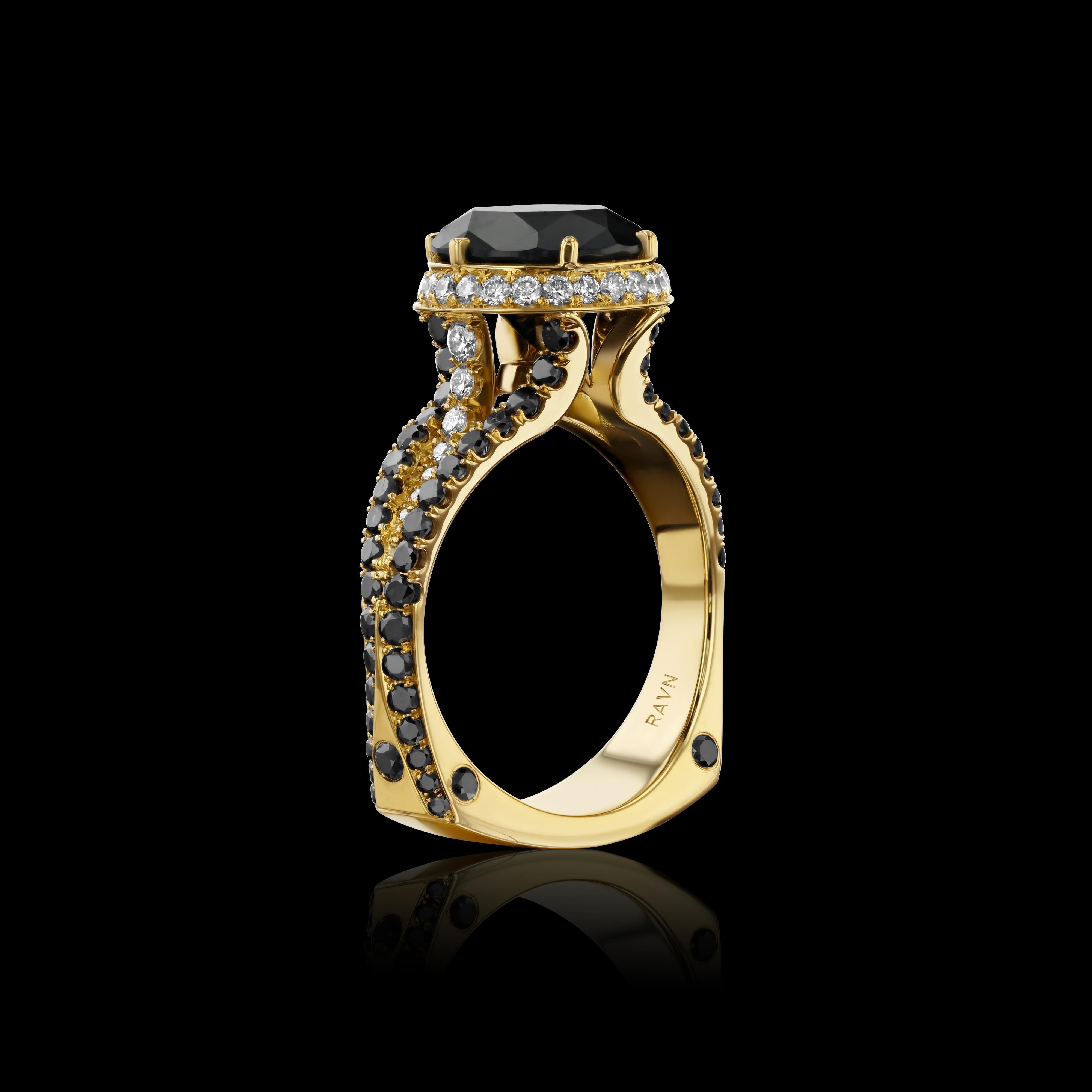 From the House of RAVN Diamond Collection, this cocktail ring features a 3.77-carat black diamond center set in 18k yellow gold, accented with 38 white diamonds and 74 black diamonds. Each piece is made to order and one of a kind—no two are exactly