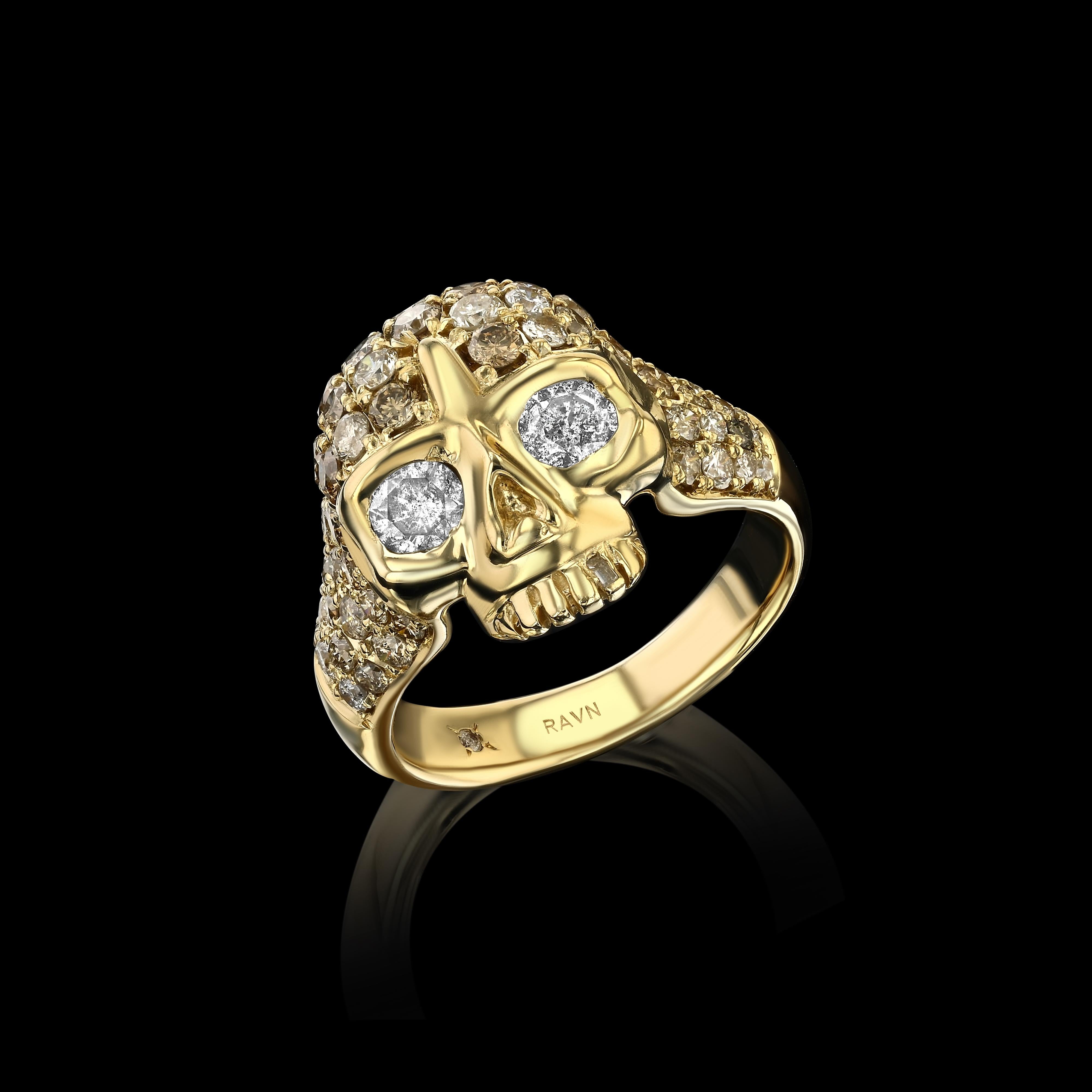 18k yellow gold, hand carved, skull ring, with diamond eyes, baguette diamond tooth and encrusted with 73 champagne diamonds (2.4ct). 