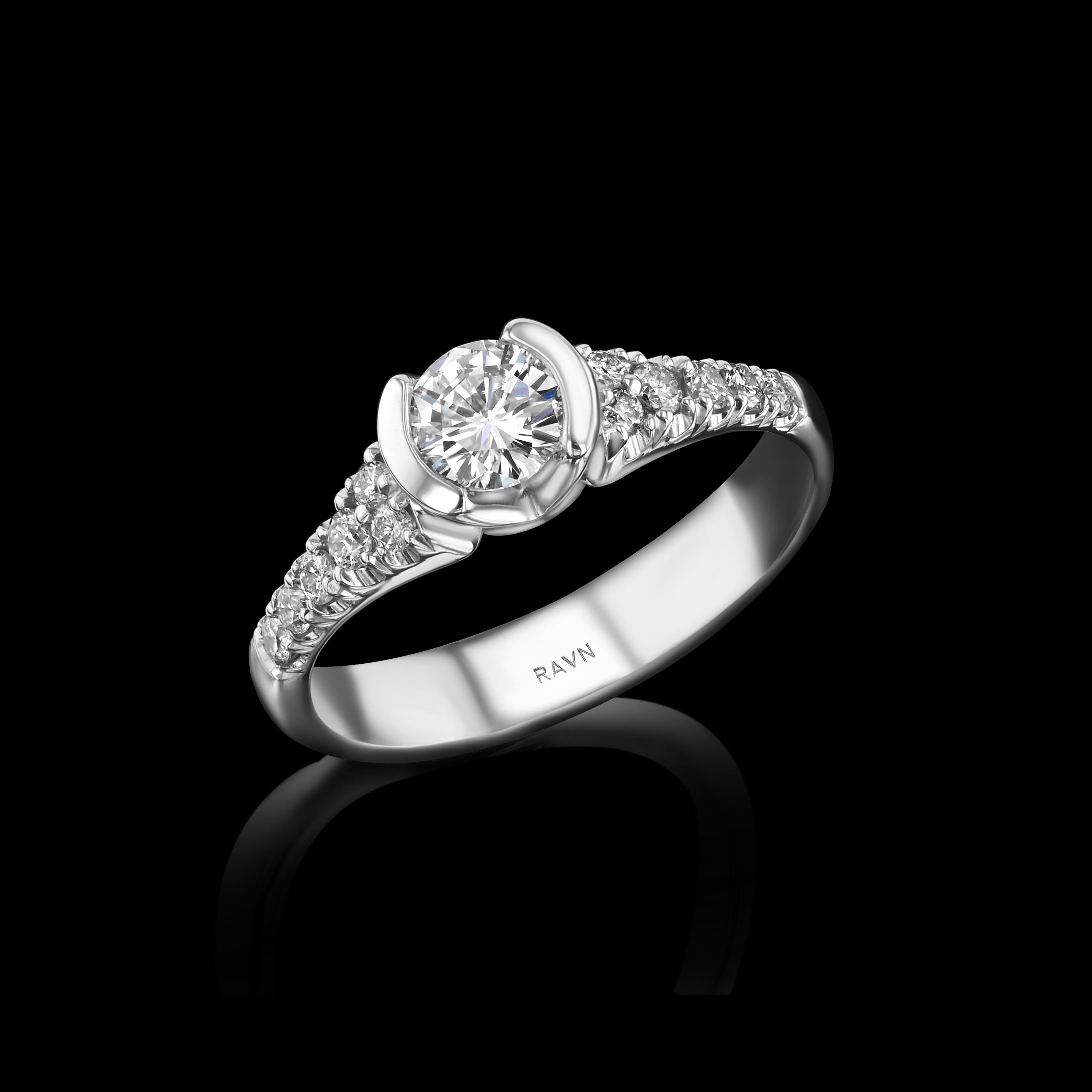 18k white gold, hand carved half bezel ring with a 0.35ct center diamond and 12 shoulder diamonds (0.12ct) from the House of RAVN Diamond Collection.   


Features .47ct total diamonds.    



The House of RAVN Diamond Collection is as an opulent