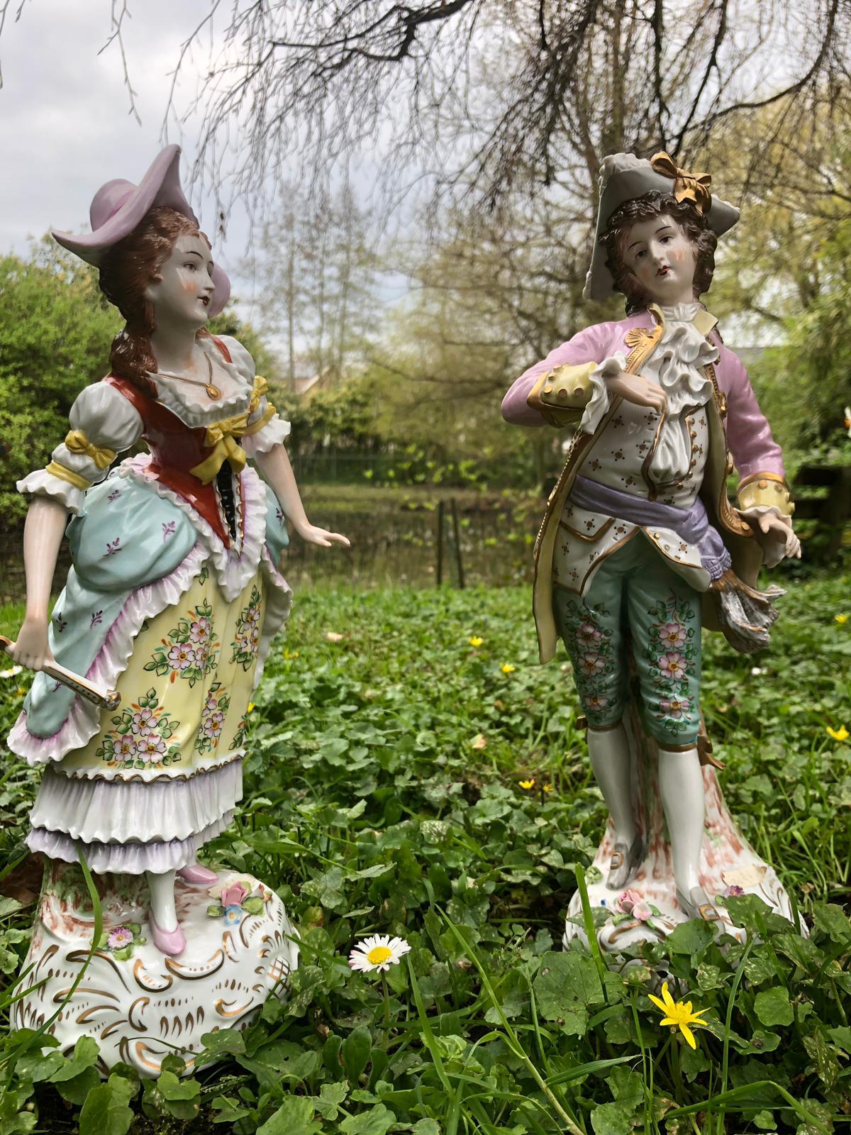 This porcelain couple is from the House of Sitzendorf. The items were made in German. The manufactory is from 1850. The figures are handmade from porcelain and painted in the features tones of green, yellow, purple and salmon. And many more
