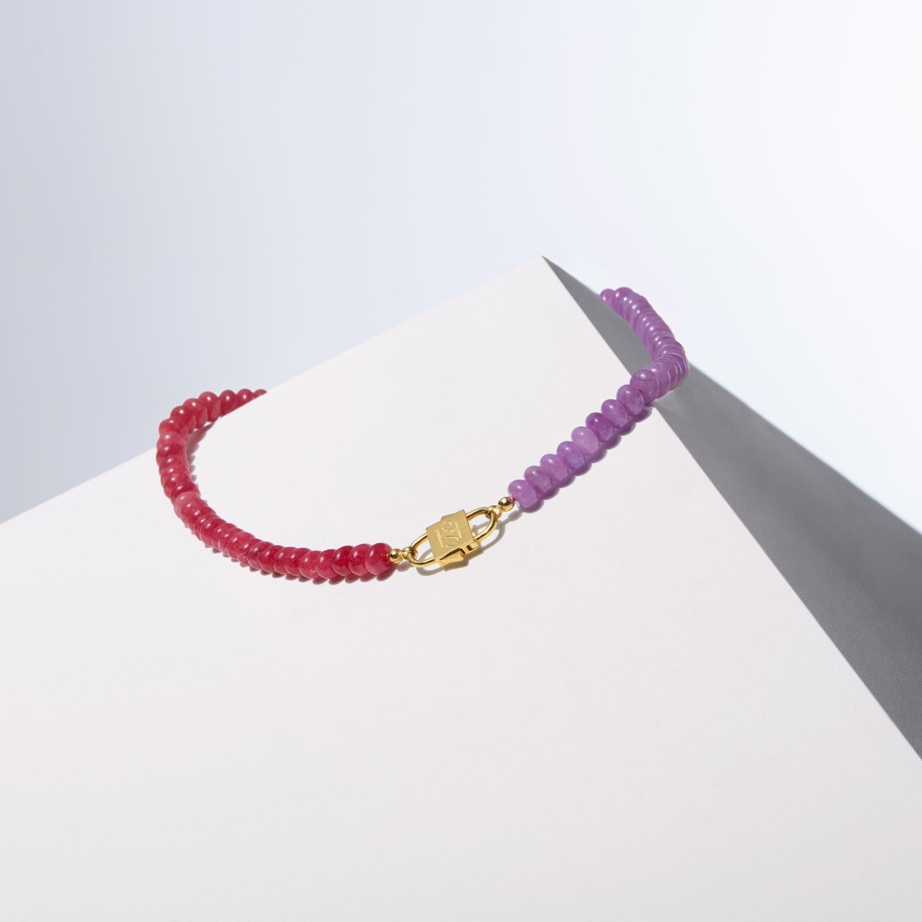 - Masterfully crafted with Rhodonite and Kunzite colored Jade beads, each uniformly cut to 8 mm, balancing elegance and consistency.
- The vibrant pink and purple hues of the beads create a captivating contrast, making the necklace a standout