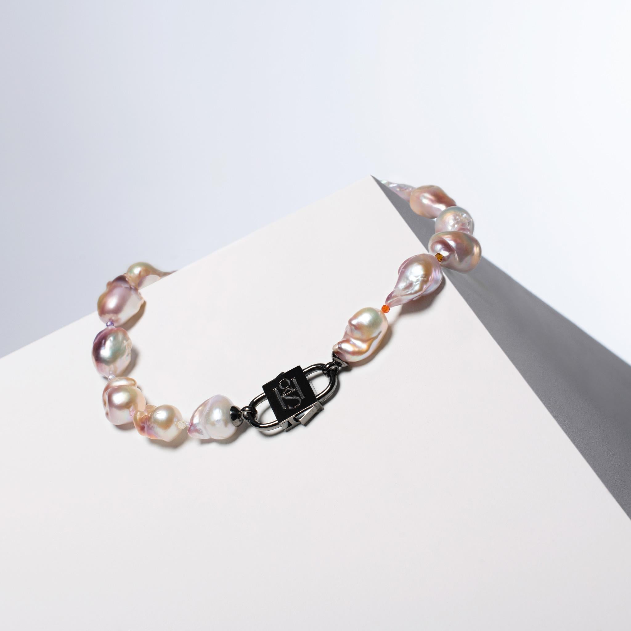 - Genuine, rare find pink baroque pearls interspersed with ornaments of colorful precious semi-gemstones for a unique and elegant aesthetic
- Pearl row is 42 cm (16.5 inches) and the HoS Lock™ measuring 3.5 cm (1.3 inches) that is is rhodium filled