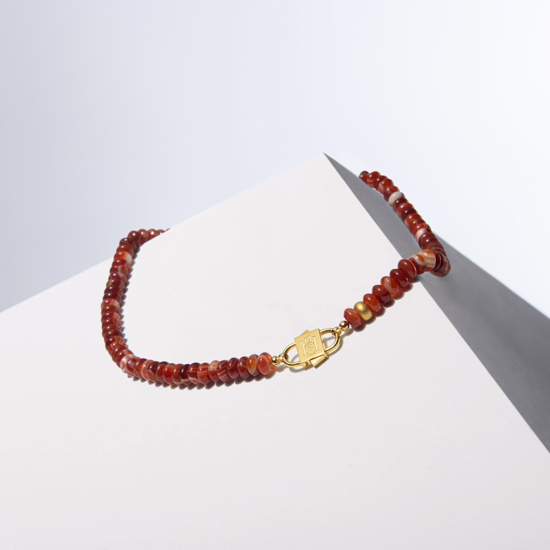 - Meticulously crafted with 8mm rondelle red agates, each handpicked for their distinctive charm and intense, vibrant color.
- The fiery red agates in the necklace exude a warm, eye-catching radiance, making it a standout accessory for any