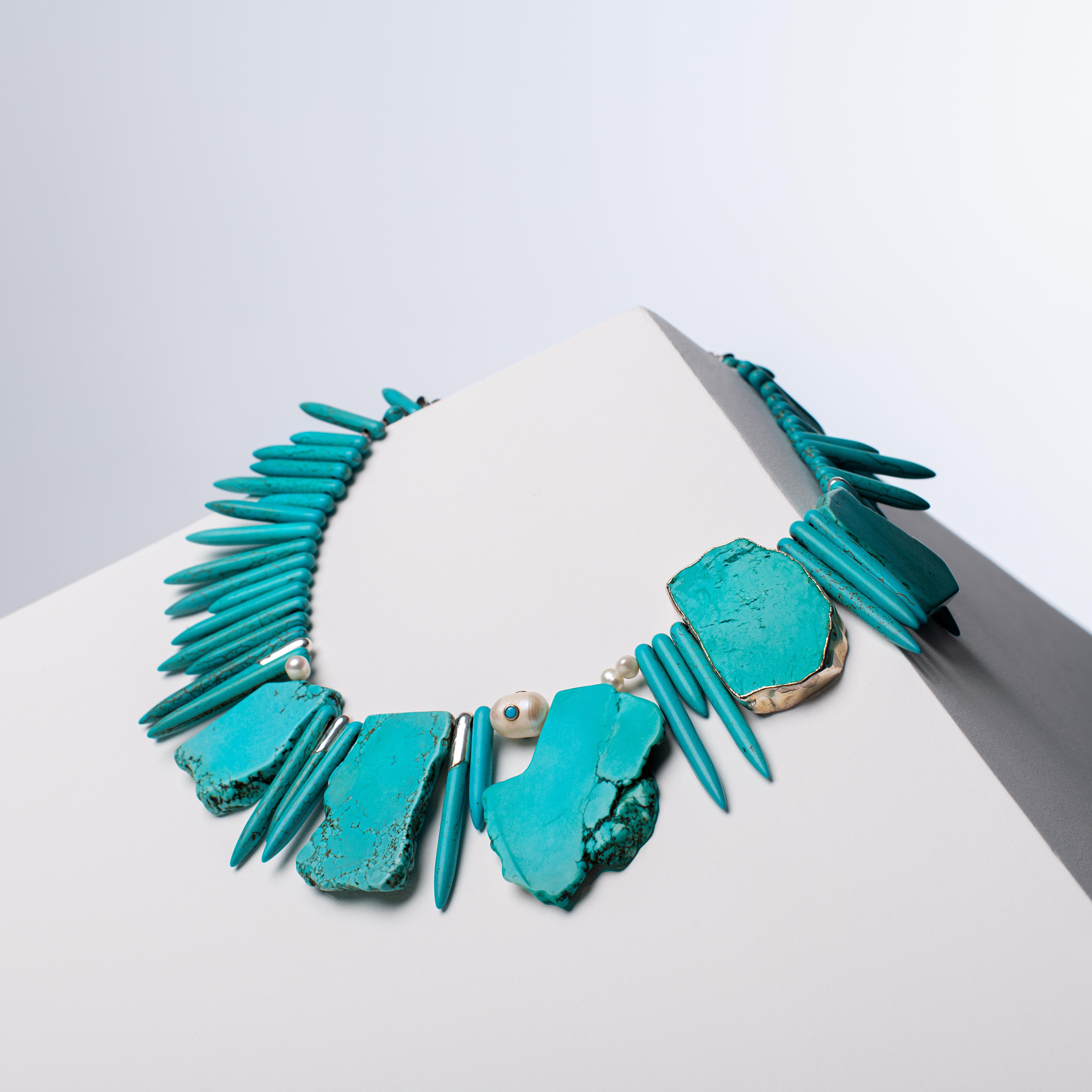 - Dynamic and unique necklace featuring two distinct cuts of Turquoise Howlite — slab and spike — artfully combined with natural pearls for a stunning visual contrast
- Each necklace presents a one-of-a-kind design, shaped by the natural form of the