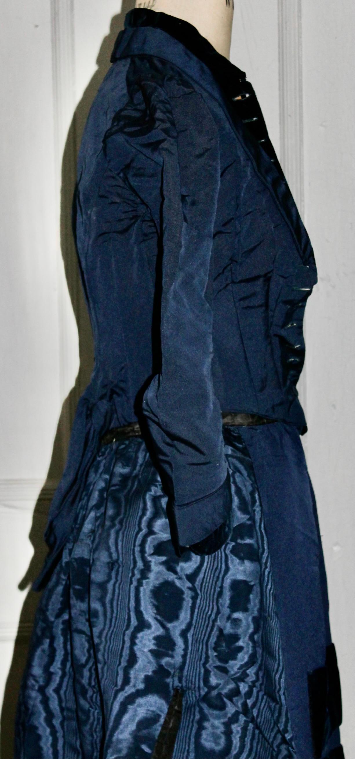 In a Blue Silk Moire, a rare House of Worth circa 1875 Gown. Jacket Bodice: waist 20
