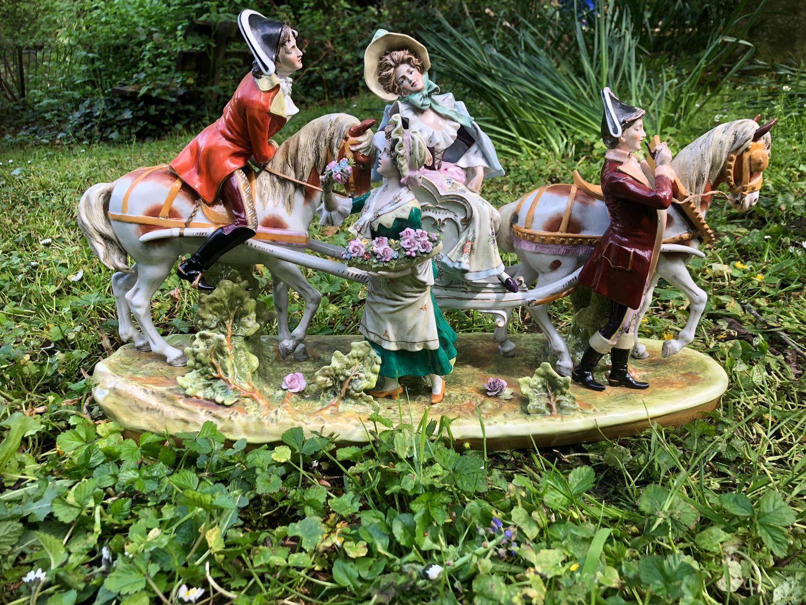 House of Scheibe Alsbach founded in 1835. The porcelain figures are manufactured in Germany, before 1989. The figures are a love couple, a flower girl and a horse boy. They are on the horse-drawn carriage.
The figures are handmade from porcelain