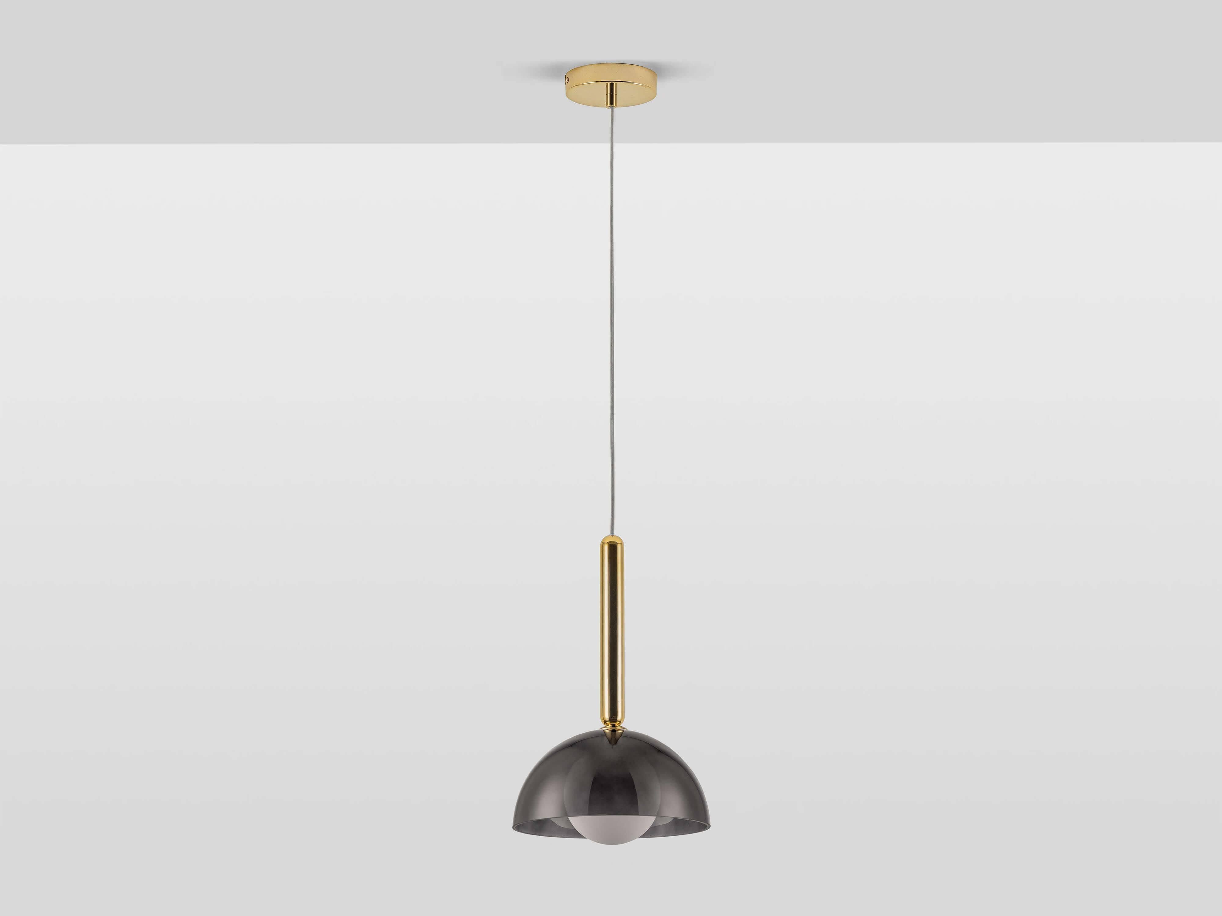 Used alone, in pairs, or more, these pendants cast a warm ambient light in any space. Perfect for over the breakfast bar, or as a statement hanging light in any room, they are delicate yet modern, with a glass dome housing the bulb, and hanging from