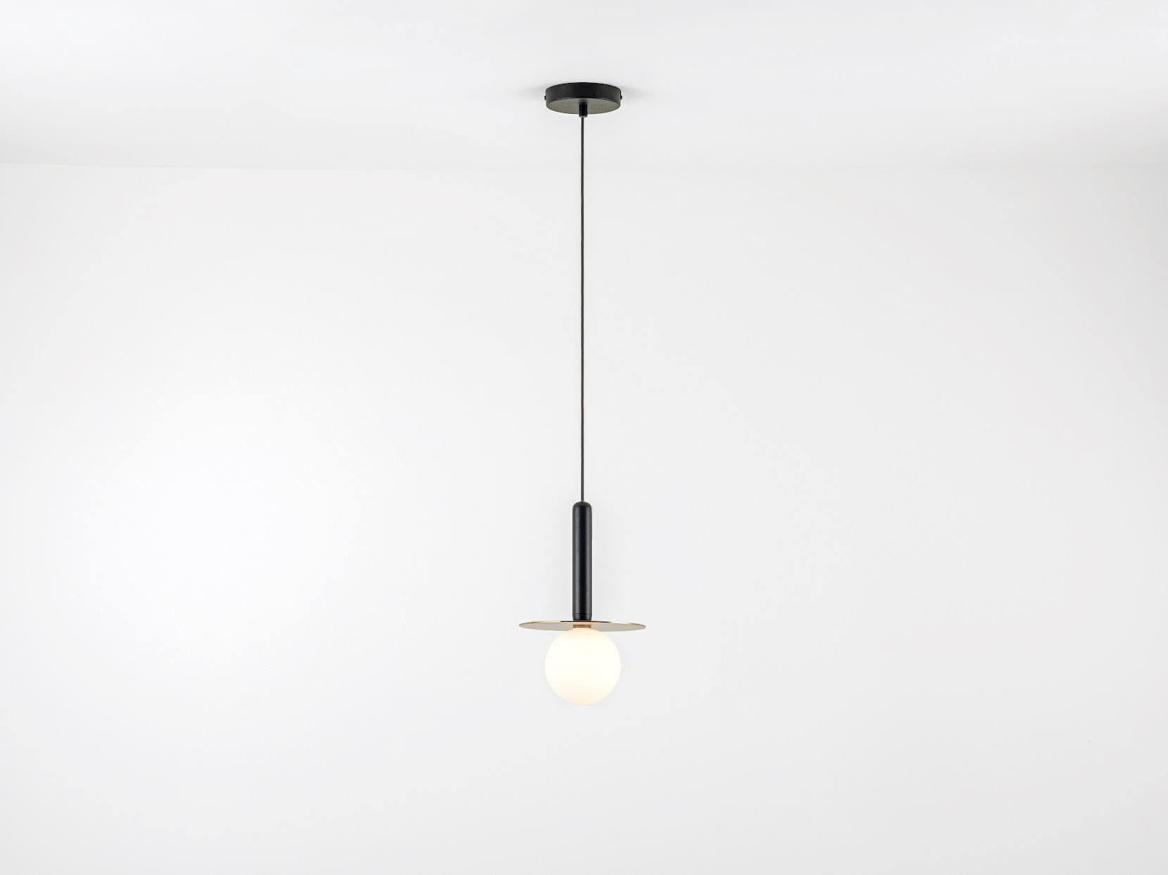 Our brass plate pendant ceiling light is a flexible and striking fixture. Modern shapes, colours and textures combine to create this versatile ceiling light. IP44 rated it can be used as a statement light in your bathroom, kitchen, dining room,