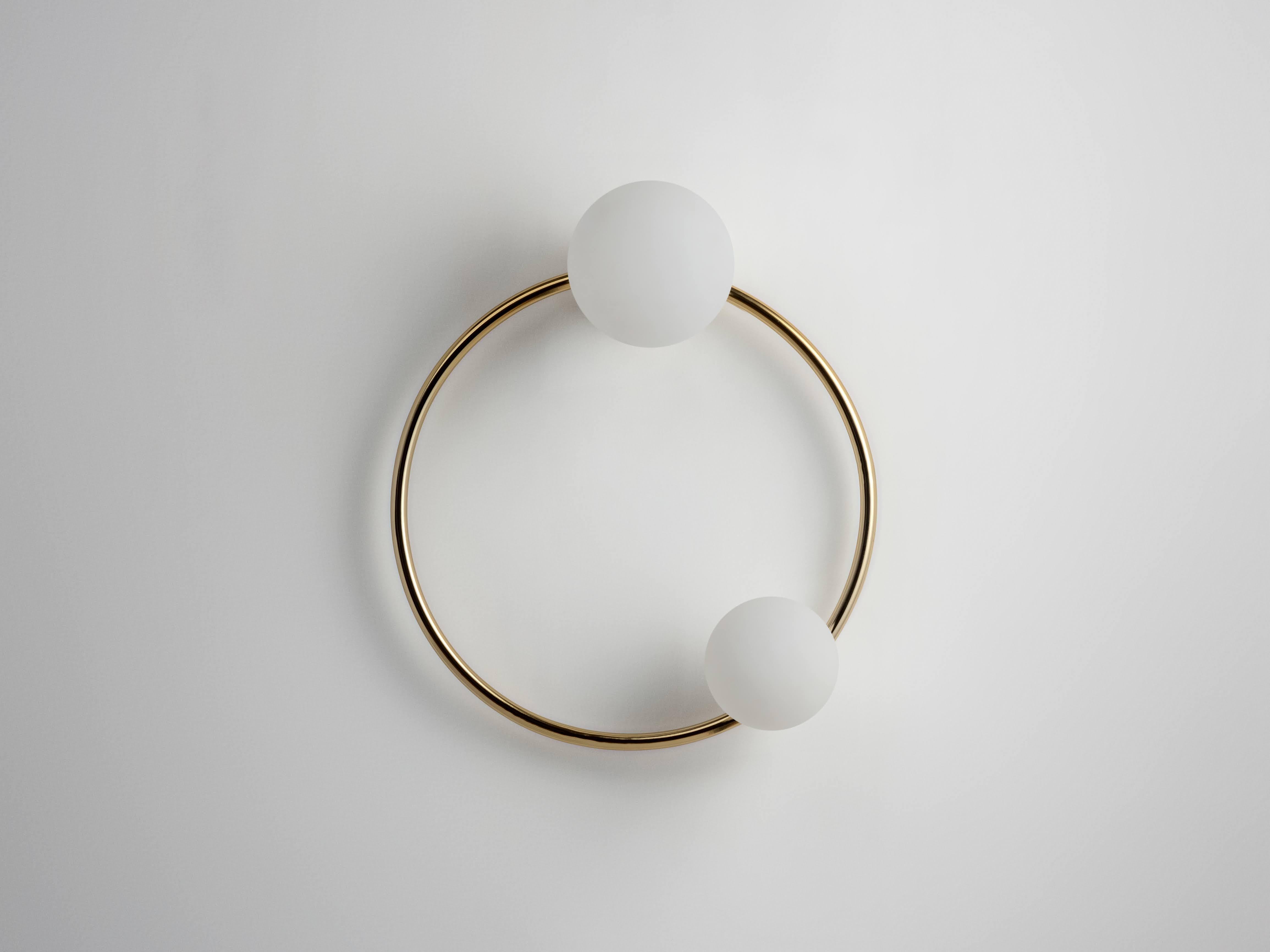 A light that double as a work of art, our iconic ring wall light combines sculptural shapes with luxurious finishes to create this eye catching lamp. Diffusing a soft light across a room, our ring light is perfect for hallways or living rooms to