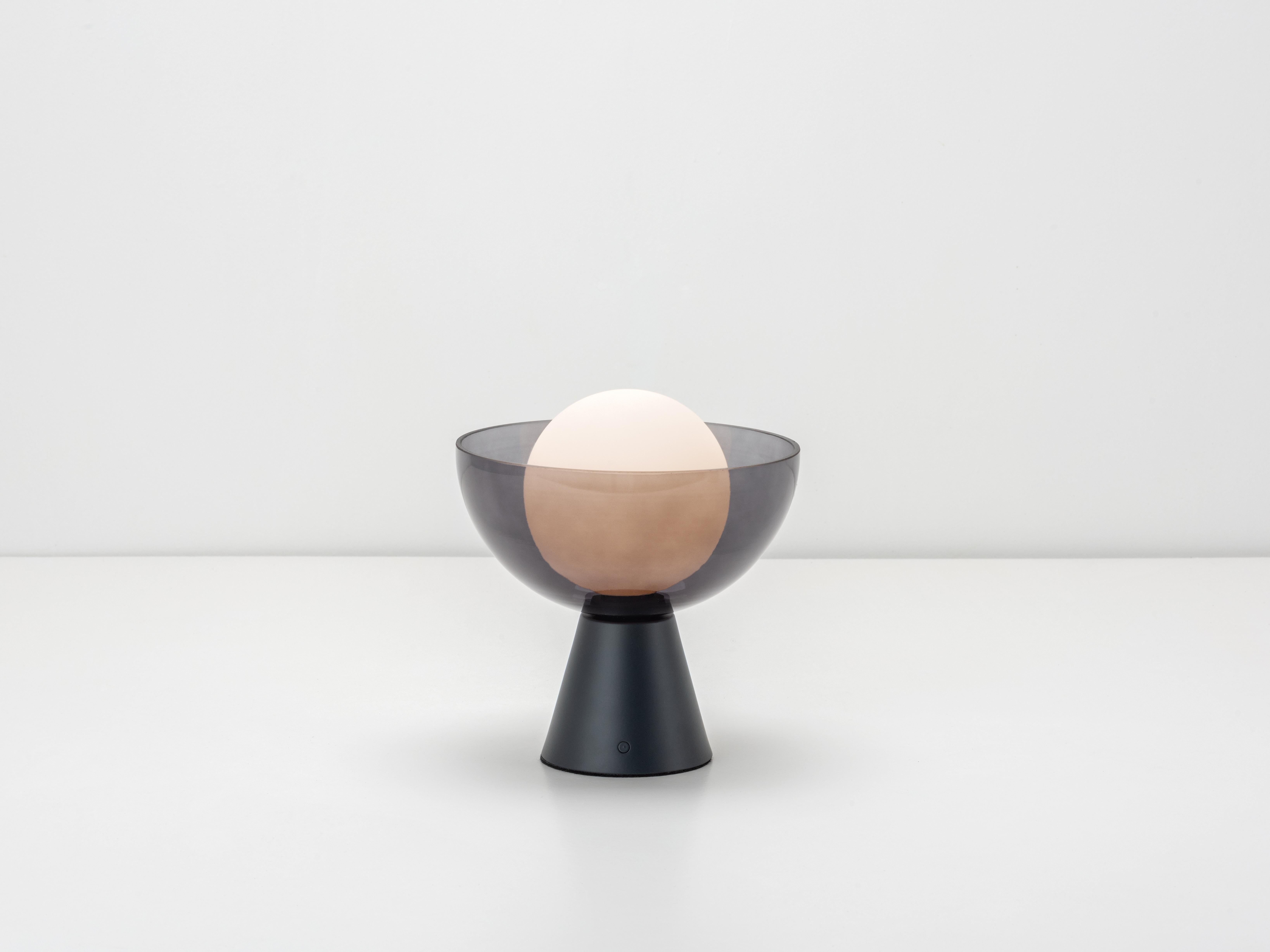 Stay ahead of the curve with our rechargeable glass dome table lamp. Proof that you can combine practicality and style, this cordless lamp is multi-functional, can be moved from room to room as the perfect lighting solution. The glowing glass shade