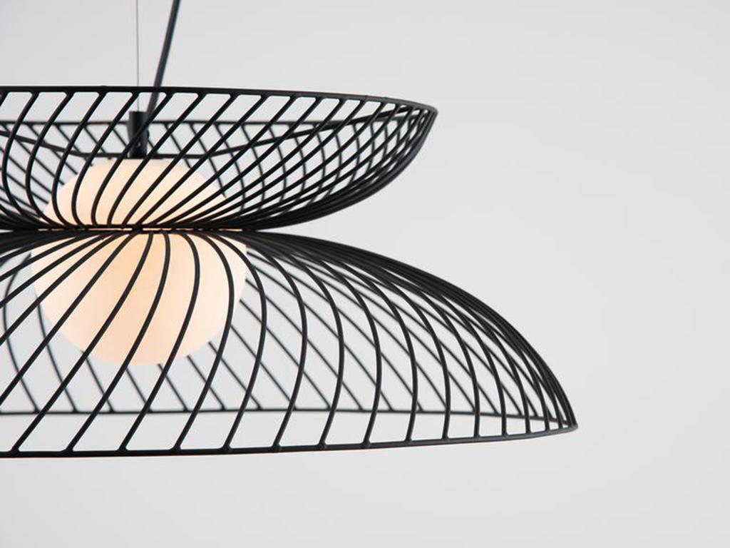 This bold statement light is perfect for a modern interior. The adjustable pendant wire suspends an opal glass shade and surrounding metal wire cage, which casts a wide atmospheric glow. Ideal for a dining space or room centrepiece. Or pitch nearly