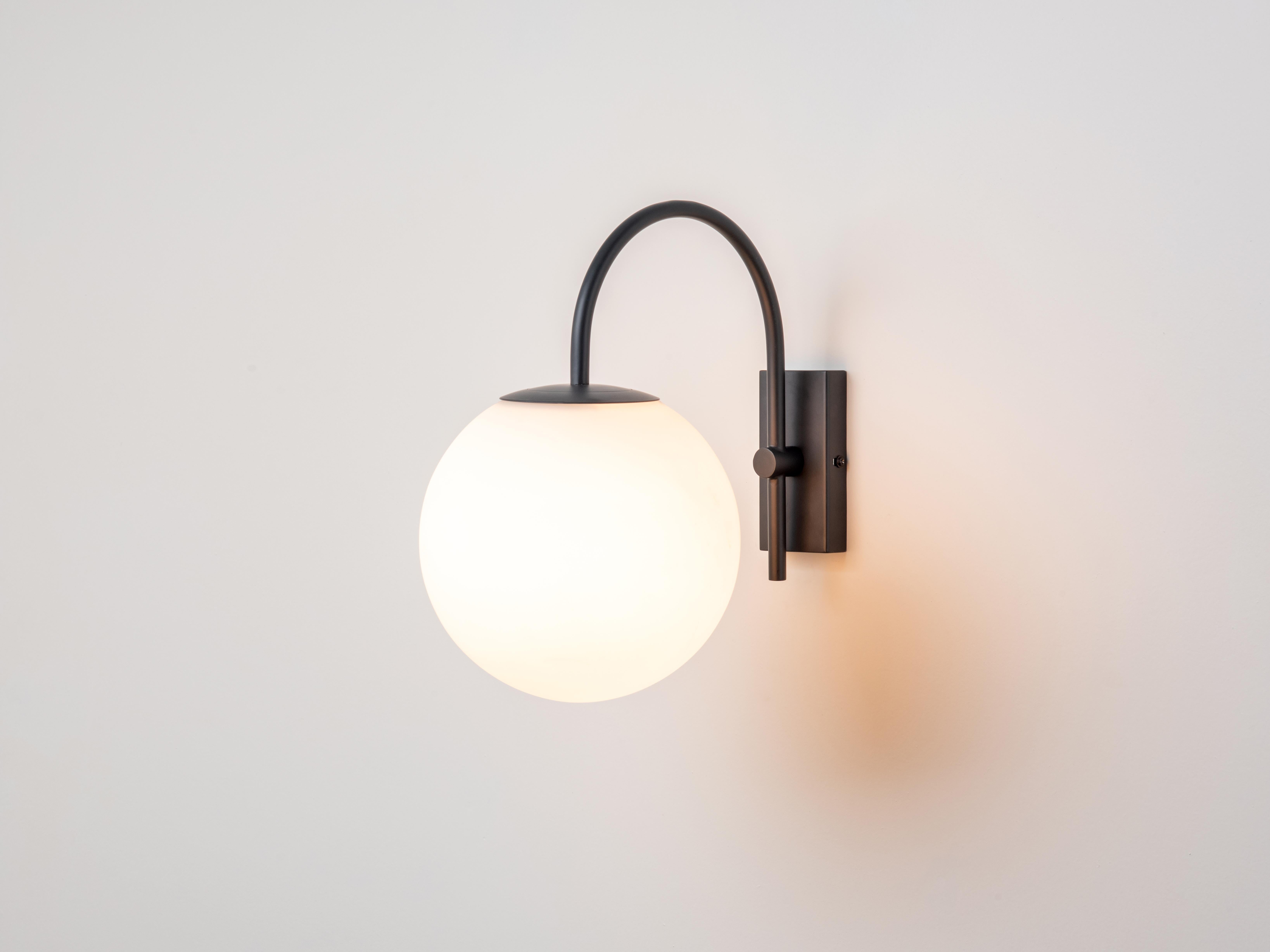 Nurture your outdoor space with our new range of outdoor lighing: this smooth matt charcoal fixture suspends an oversized 20cm glass globe and can be fitted either orientation depending on your preference. This versatile piece can be used both