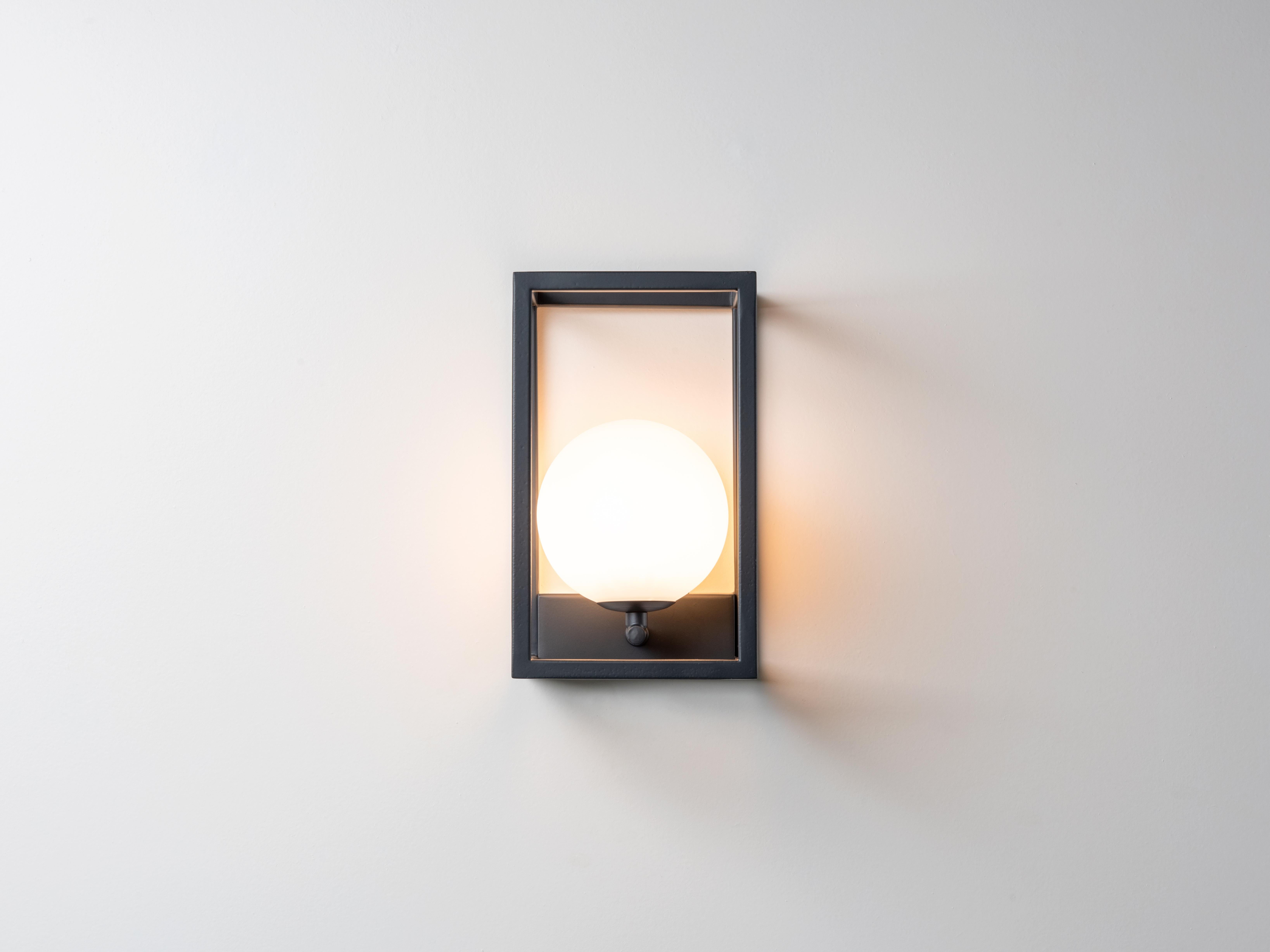 The first of our new, designed in-house outdoor lighting collection is an update to the traditional lantern style, with deconstructed walls and an illuminating glass globe. This IP44-rated wall light is waterproof and safe for outdoors. Will look