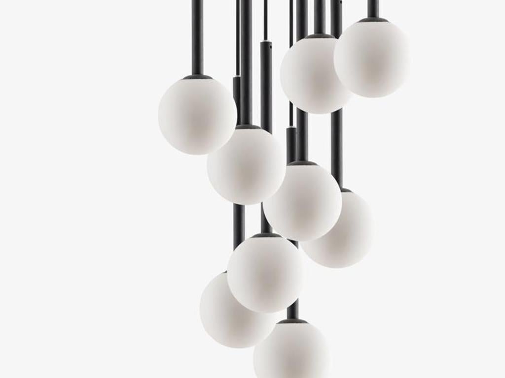 This big drop cluster ceiling light is perfect for high ceilings. The large ceiling rose suspends nine adjustable opal glass shades, which diffuse a warm illuminating glow. Ideal for a stairwell, hallway or dining room. Or pitch nearly black,