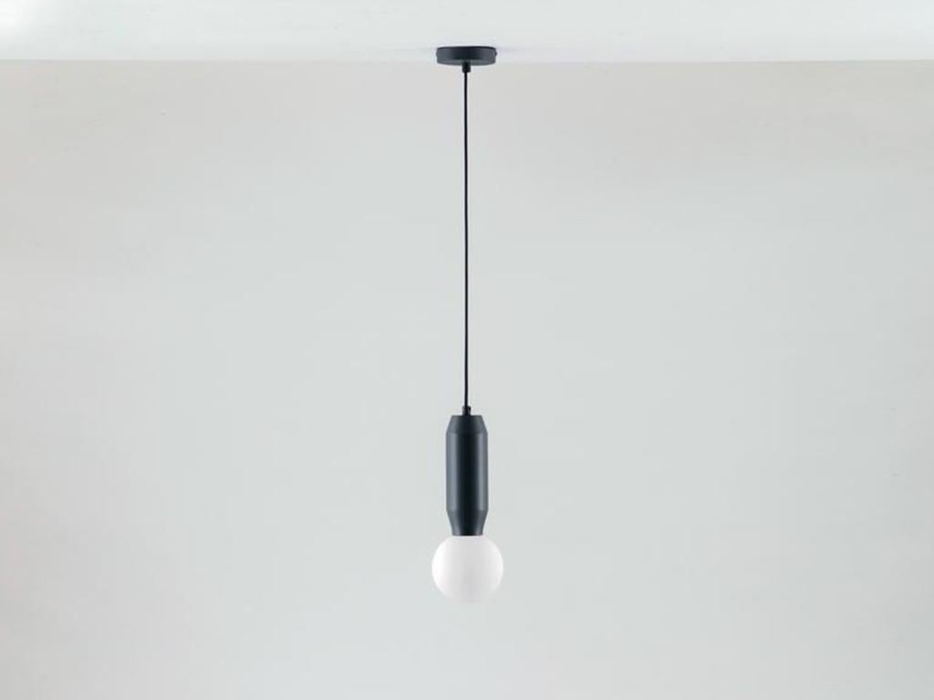 This versatile pendant light is a simple and elegant statement. The metal body holds an oversized glass opal ball, which diffuses a warm illuminating glow. Ideal for a dining space or bedroom. Single-piece pressed metal body. 2 year guarantee. Or