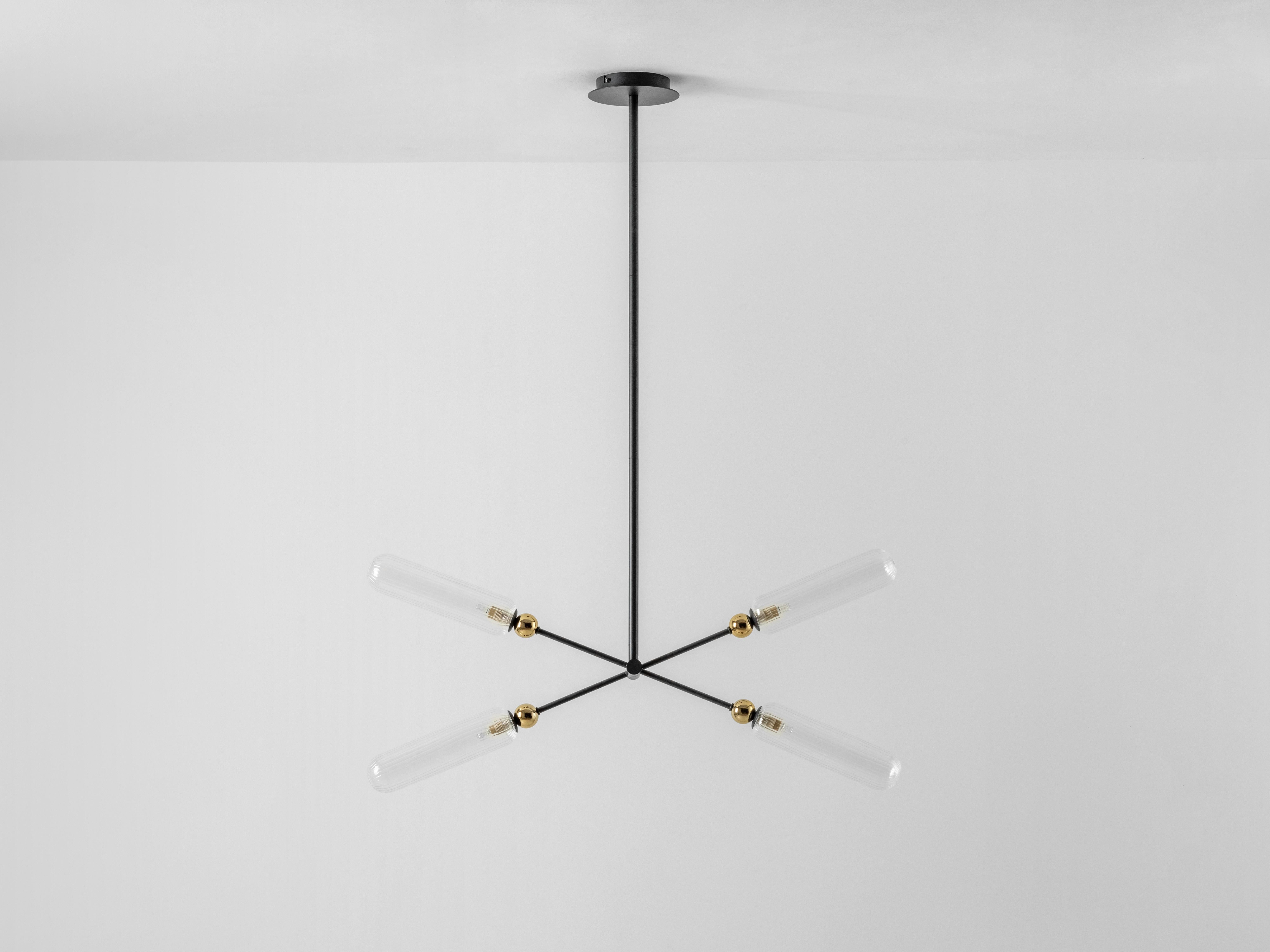 Adjustable, cross arms make this beautiful chandelier even more flexible and practical. Ideal for above the kitchen island or a dining table, simply move the arms to create the perfect ambiance for your space. Painted charcoal grey metal, with brass