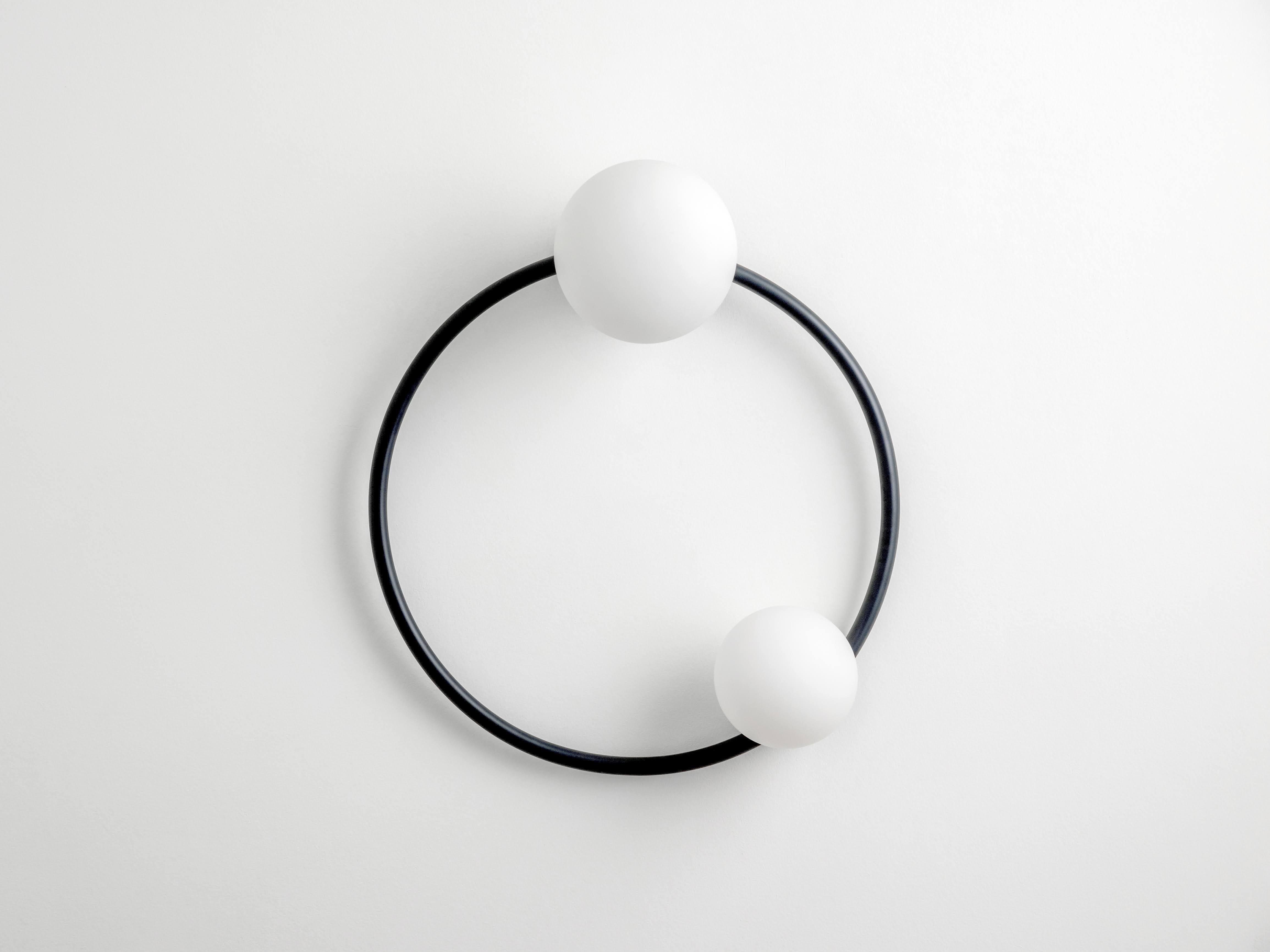 A light that double as a work of art, our iconic ring wall light combines sculptural shapes with luxurious finishes to create this eye catching lamp. Diffusing a soft light across a room, our ring light is perfect for hallways or living rooms to