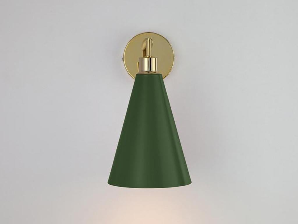 This sleek and practical wall sconce fuses traditional and contemporary. The stem base suspends an oversized cone shade which casts a wide atmospheric glow. Ideal for a living space or bedside light. Go Scandi, Olive green is a deep rich colour that